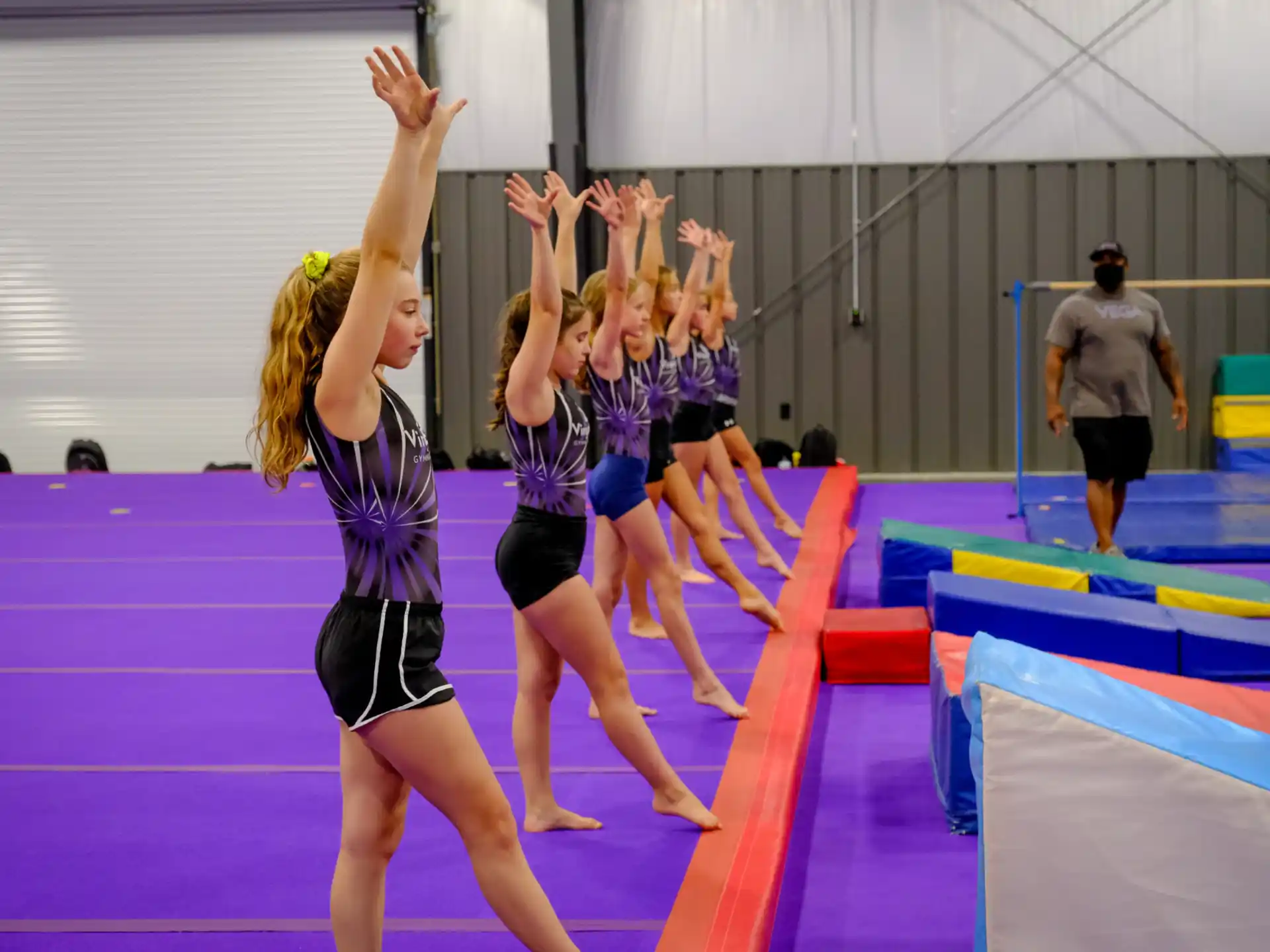 a group of people in a gym