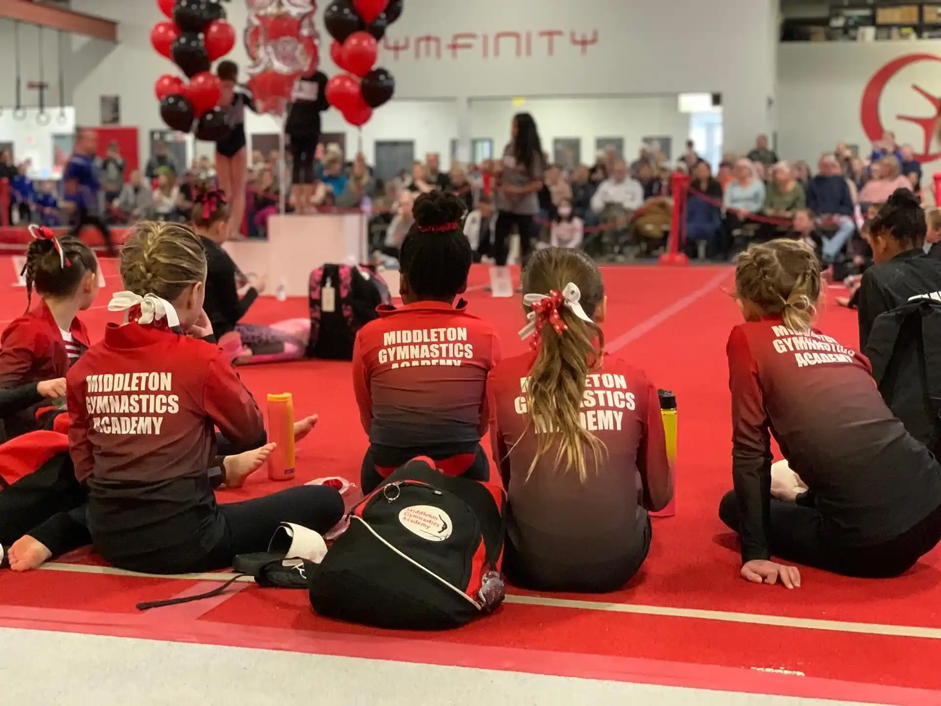 a group of people sitting on the floor