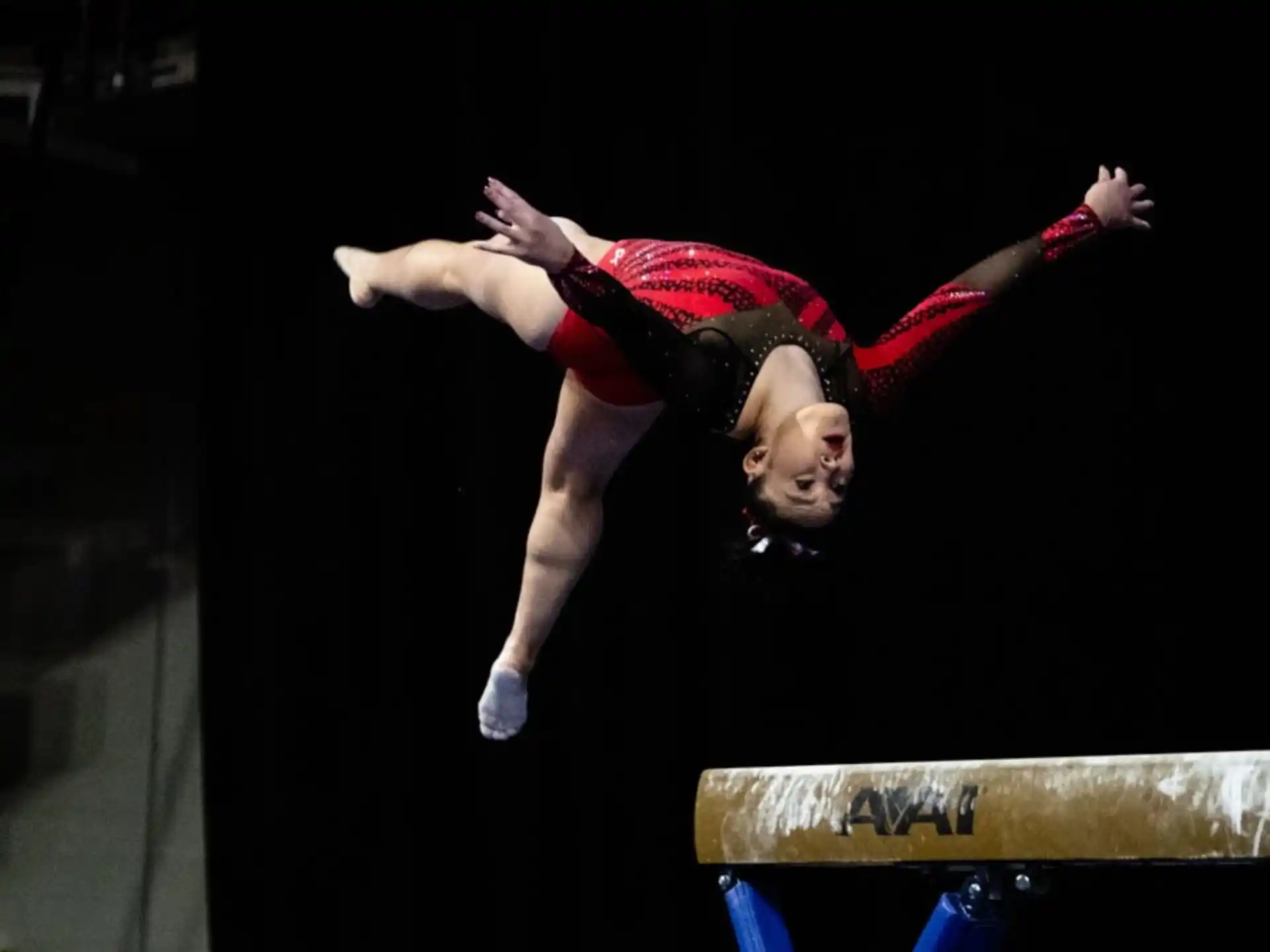 a person performing a gymnastics trick