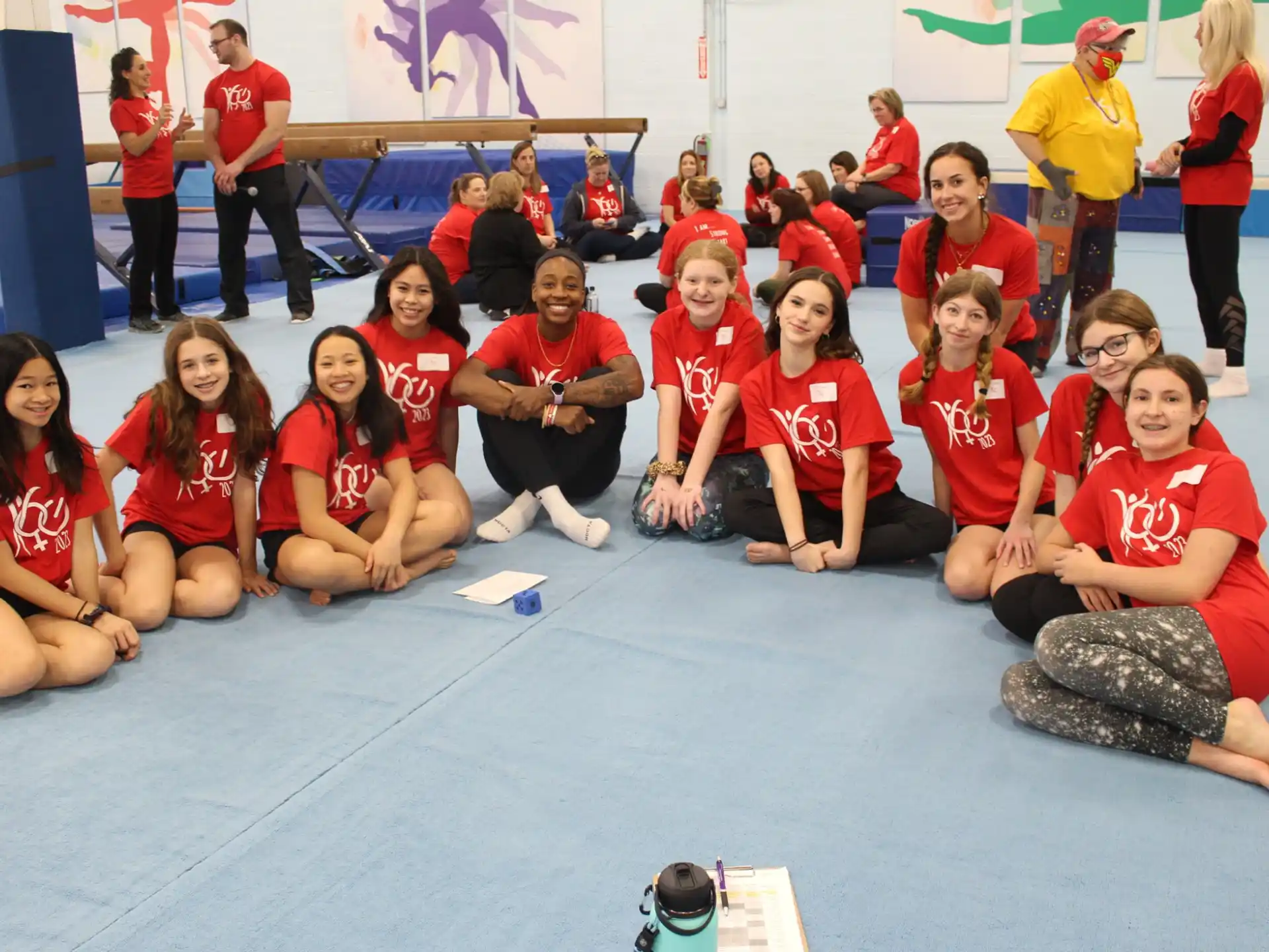 a group of people wearing red shirts
