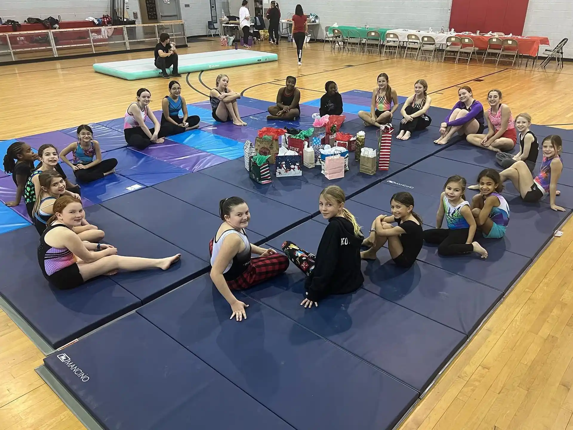 a group of people sitting on mats