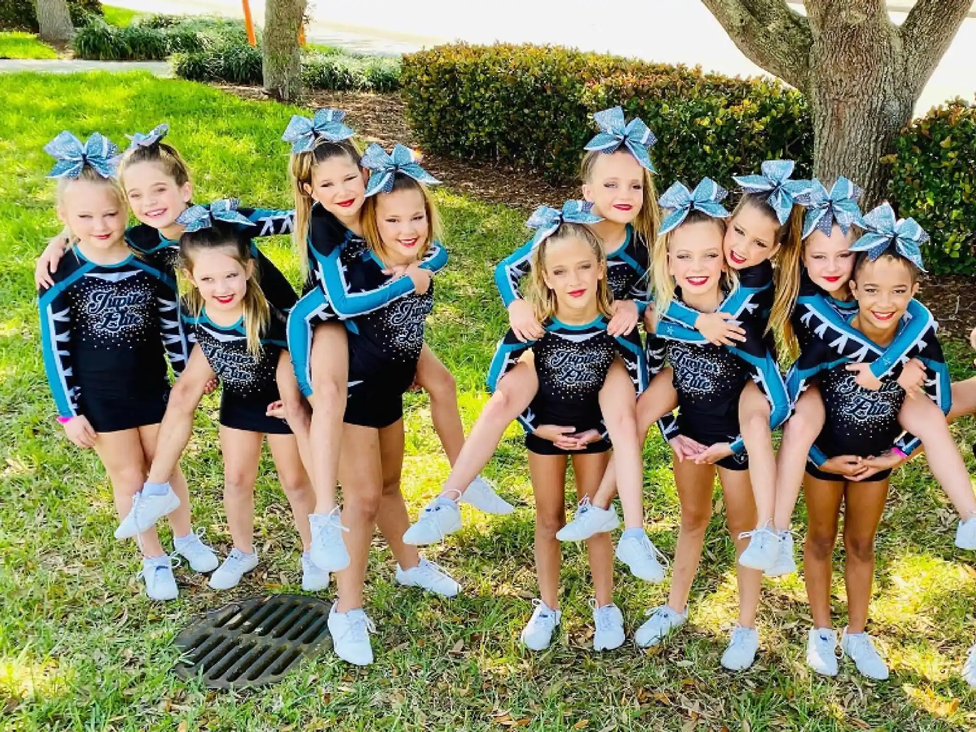 a group of cheerleaders posing for a photo