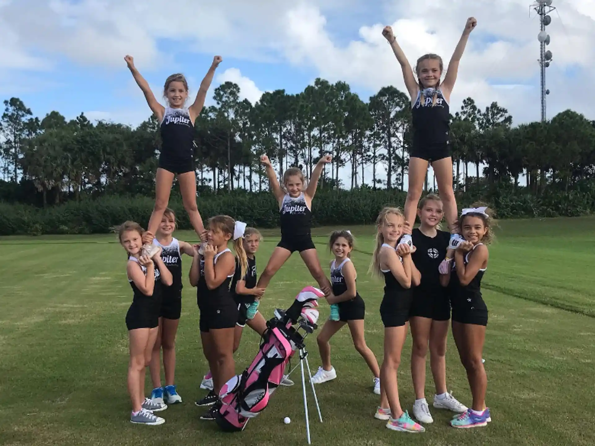 a group of girls posing for a photo