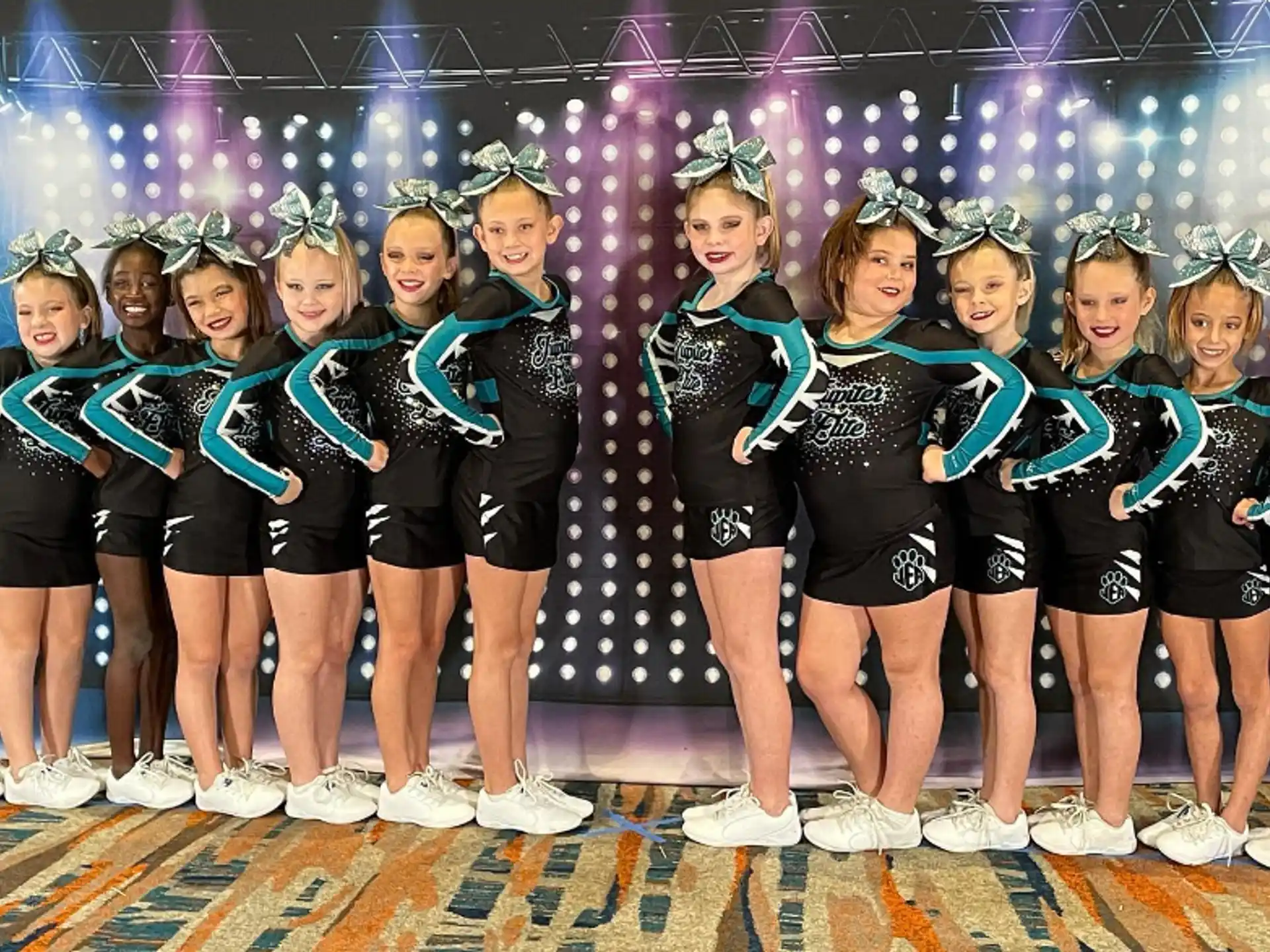 a group of women in matching outfits
