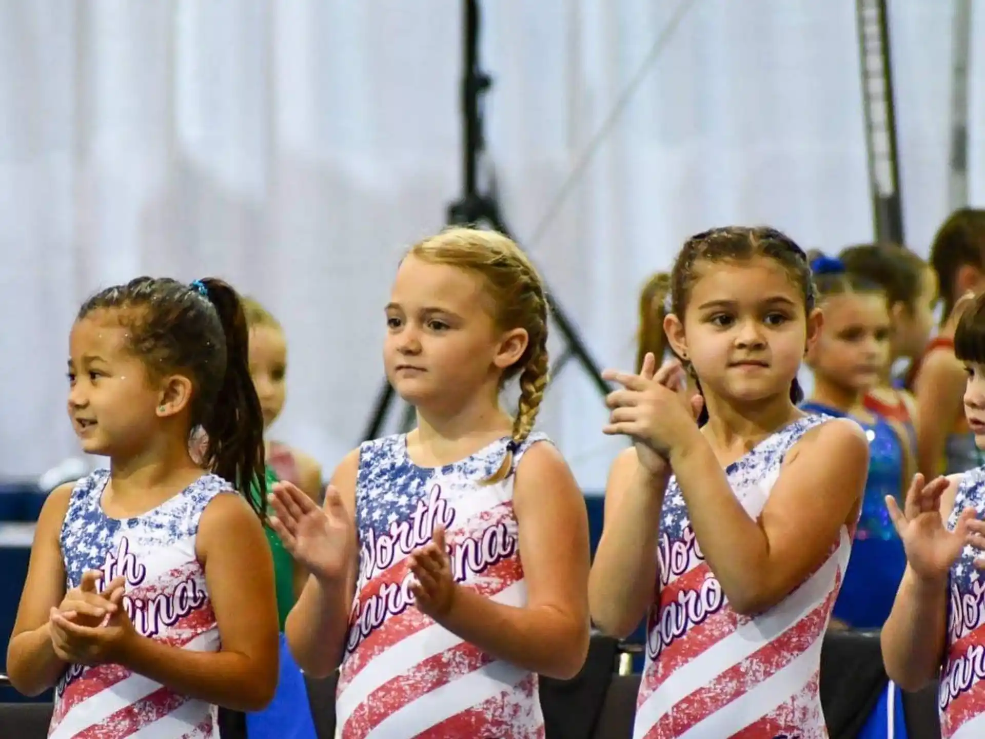a group of girls in dresses
