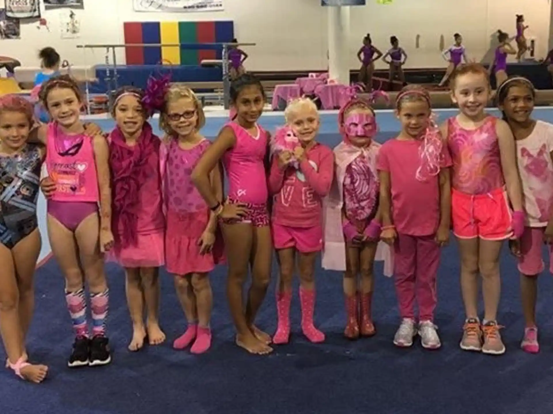 a group of girls posing for a photo