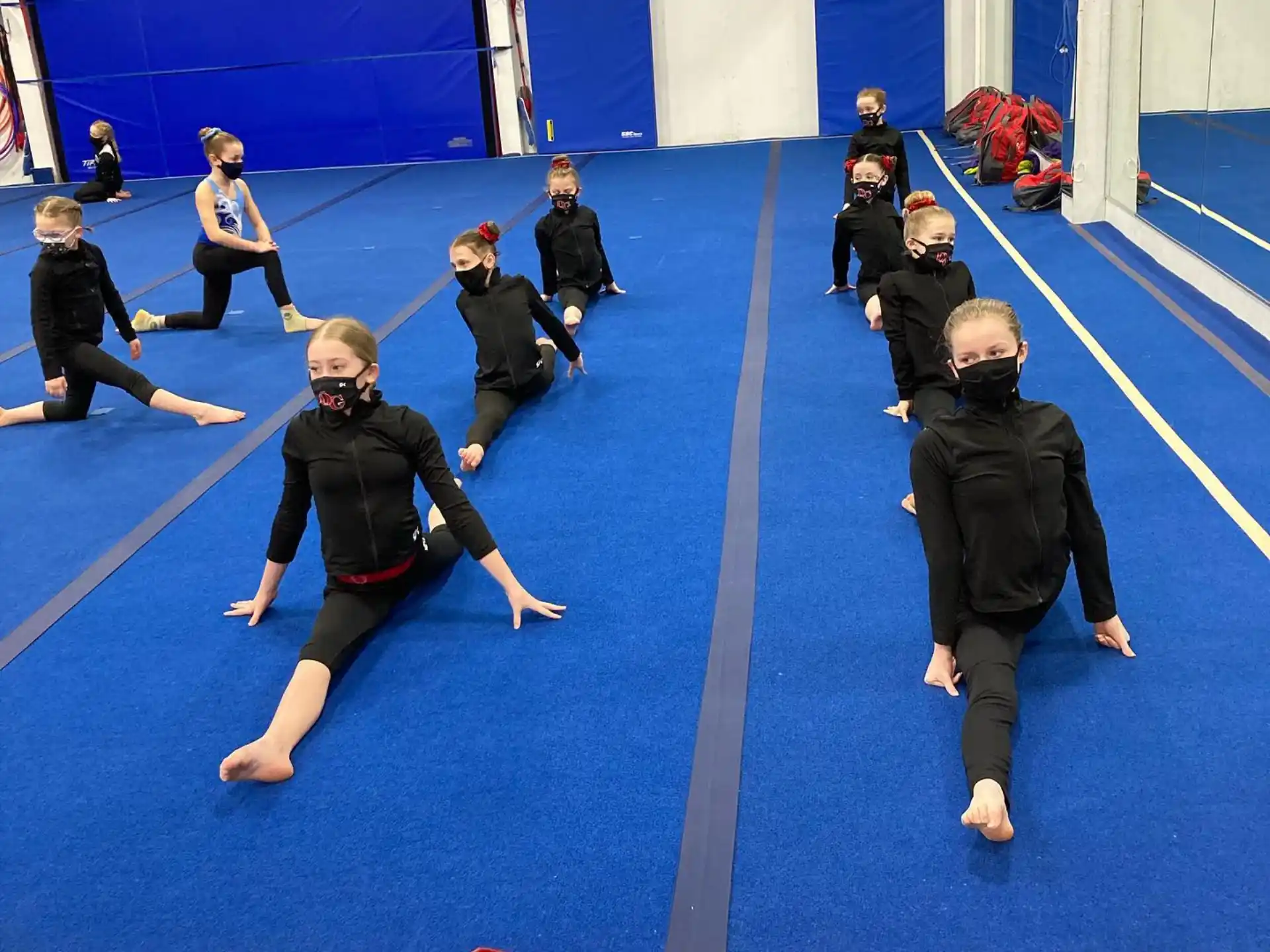 a group of people in a gym