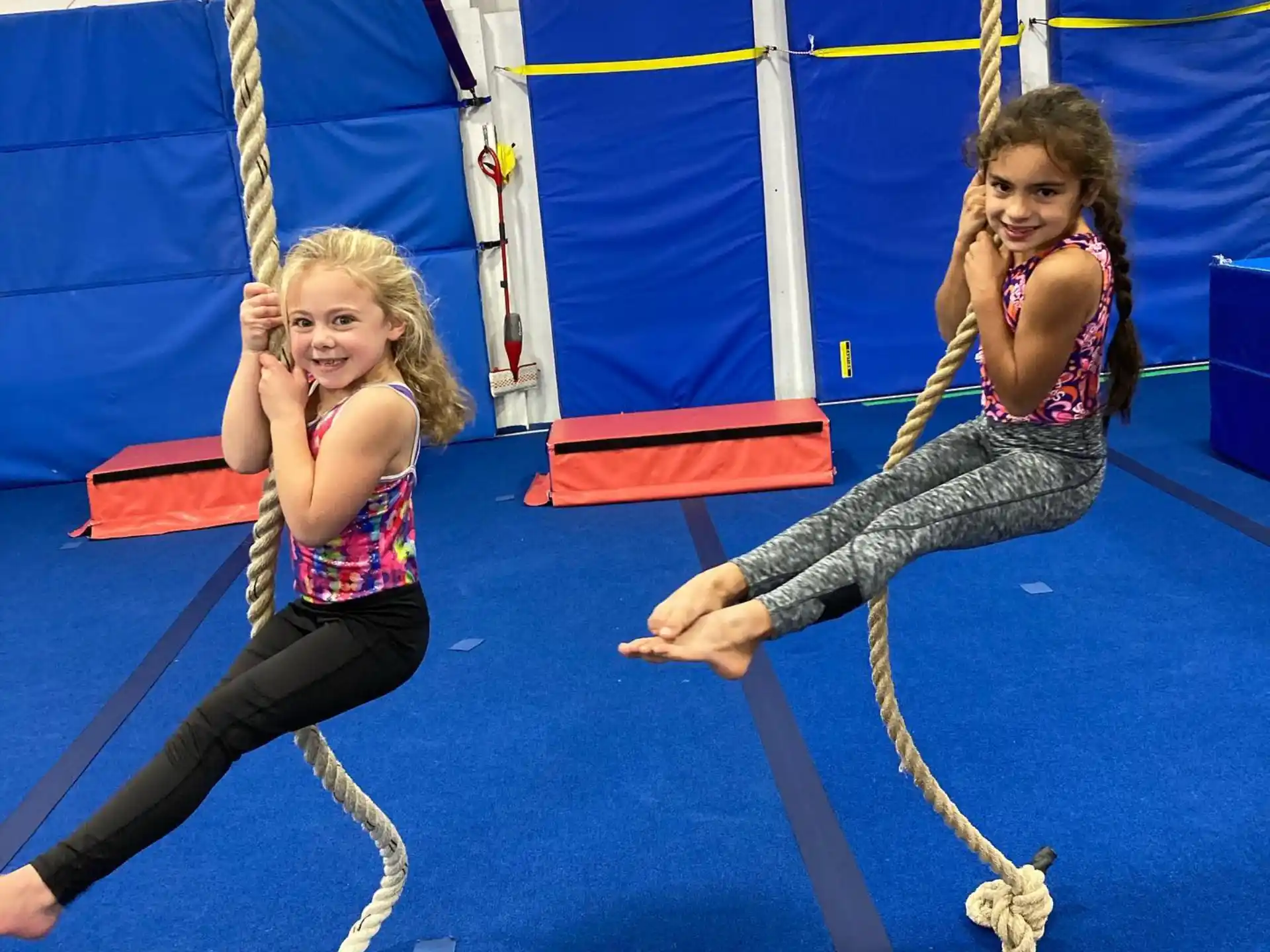two women on swings