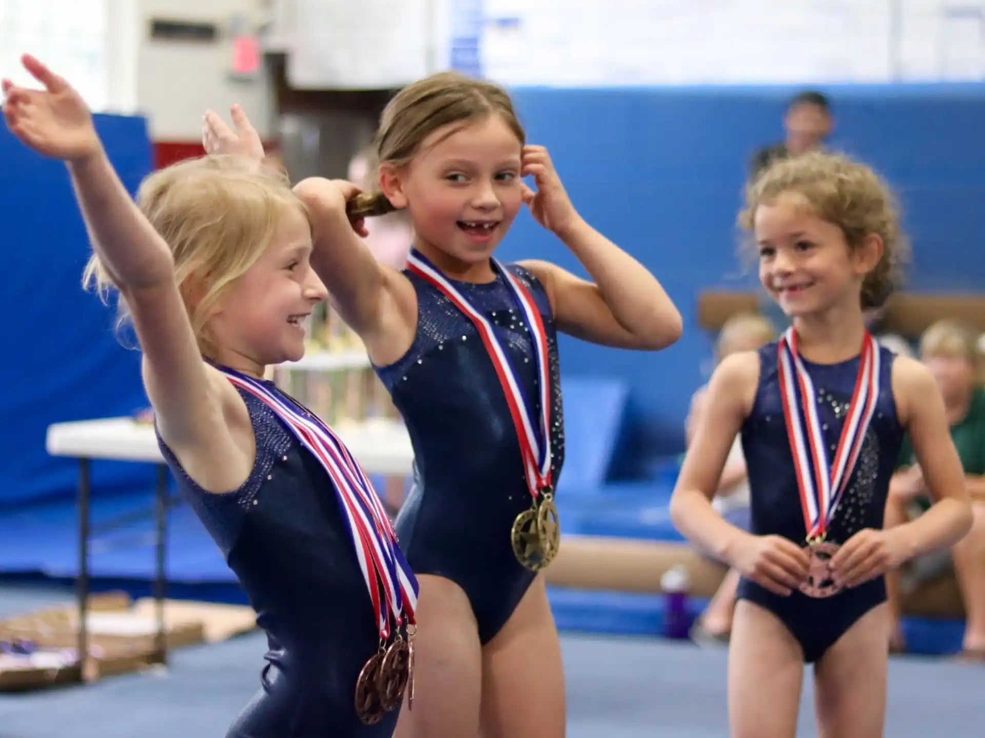 a group of girls wearing medals