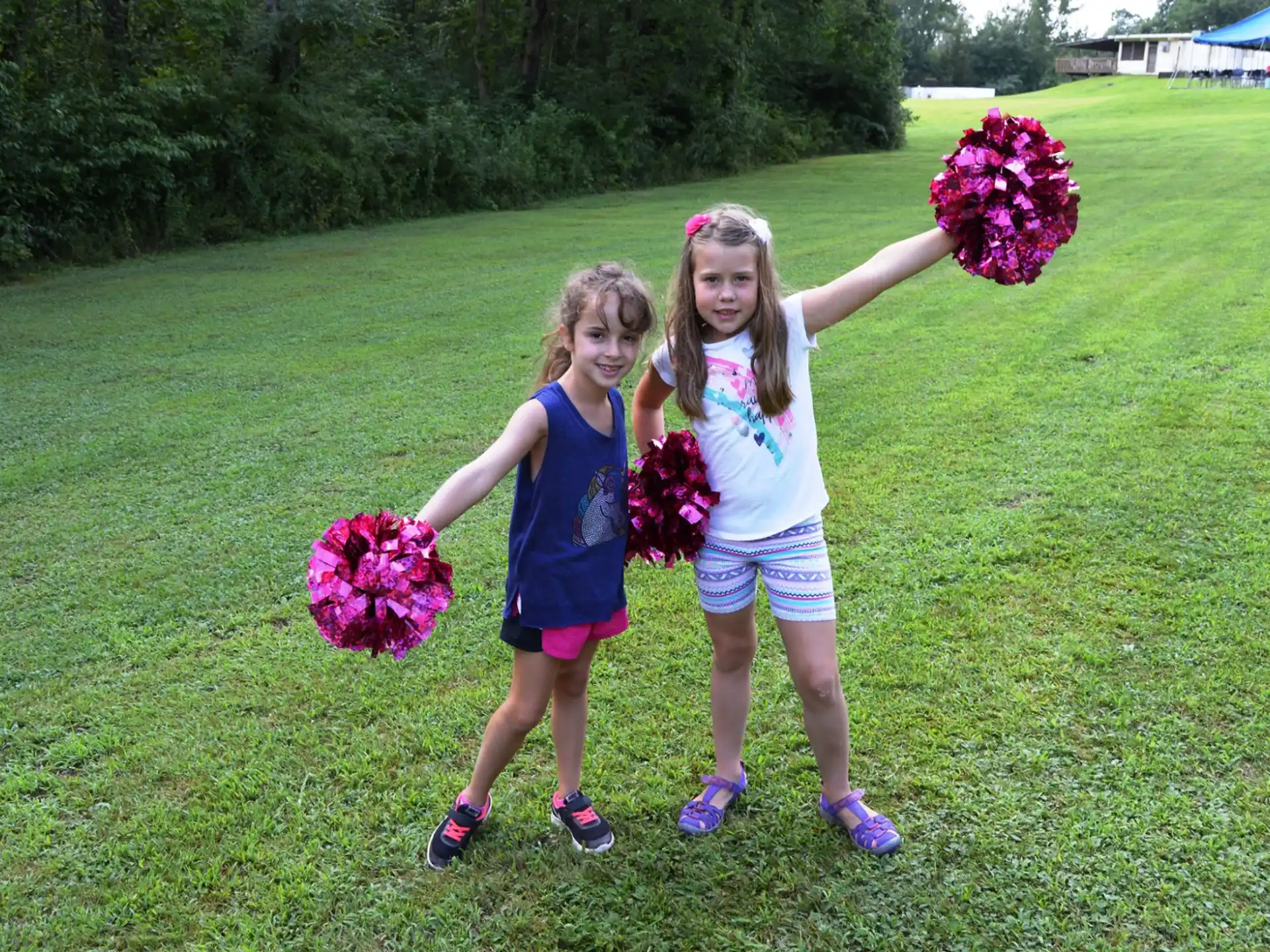 two girls holding flowers