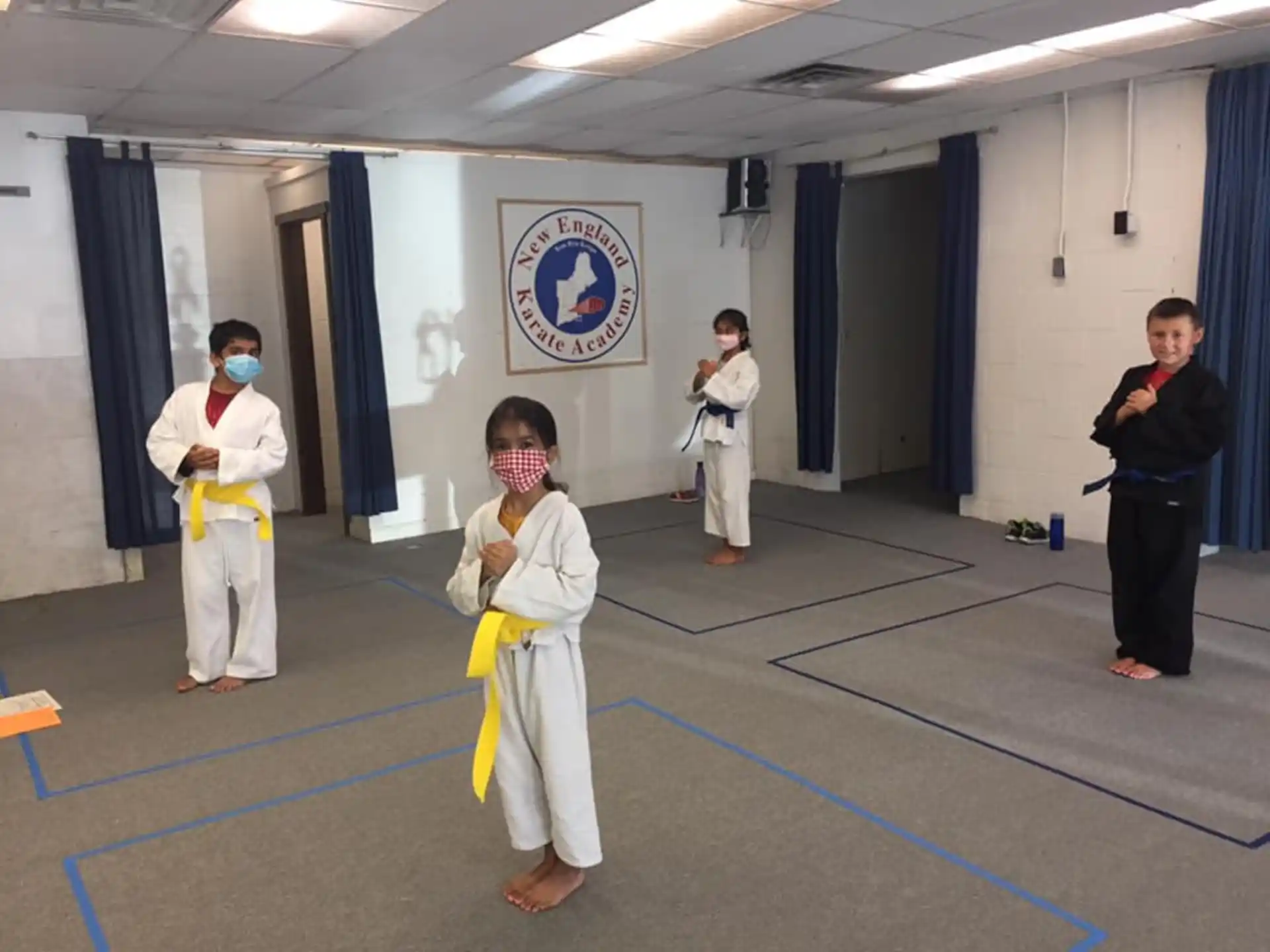 a group of people in karate uniforms