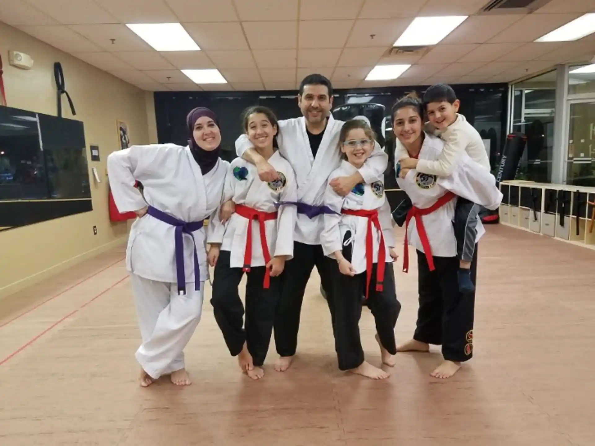 a group of people in karate uniforms