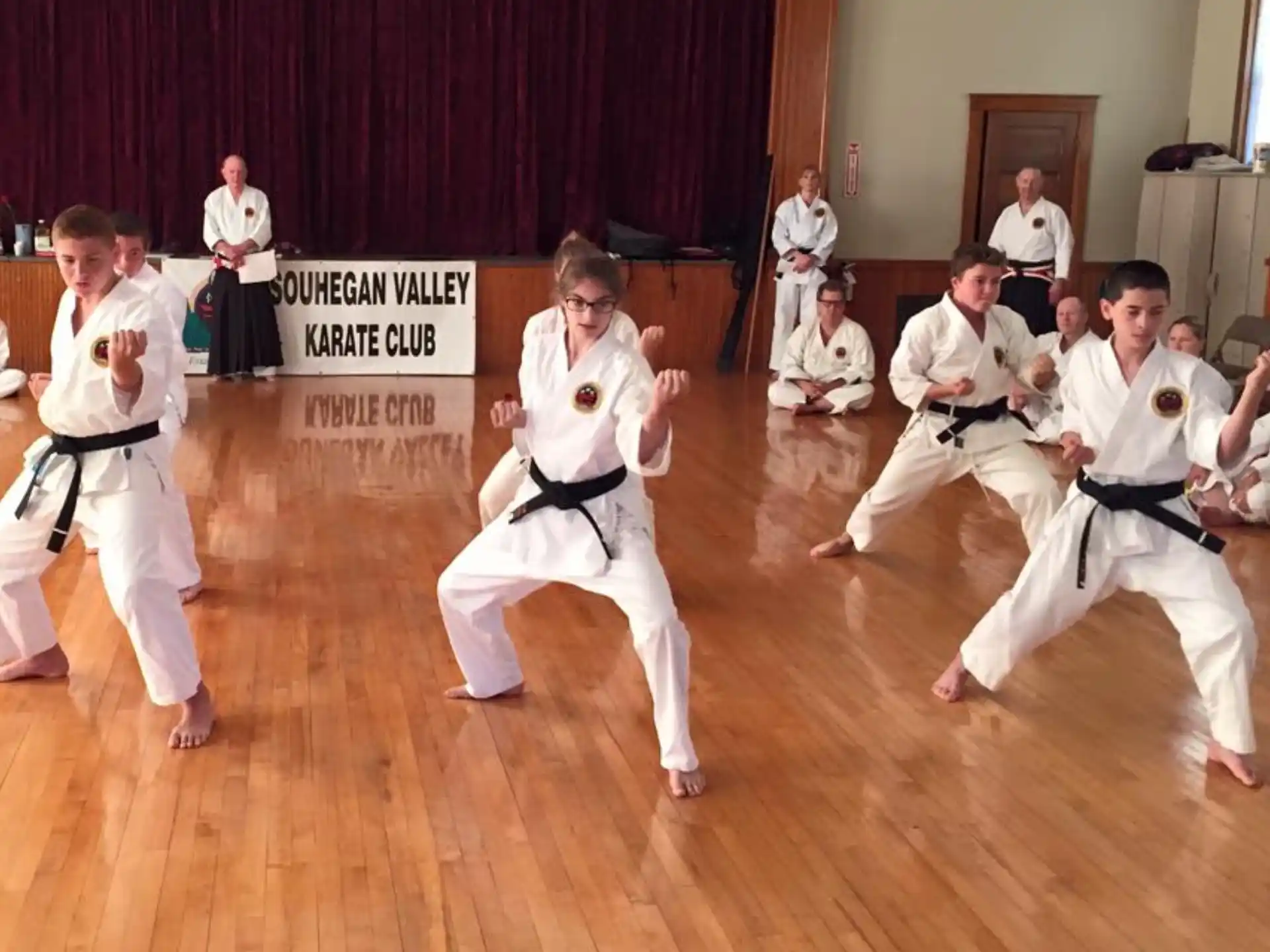 a group of people in karate uniforms