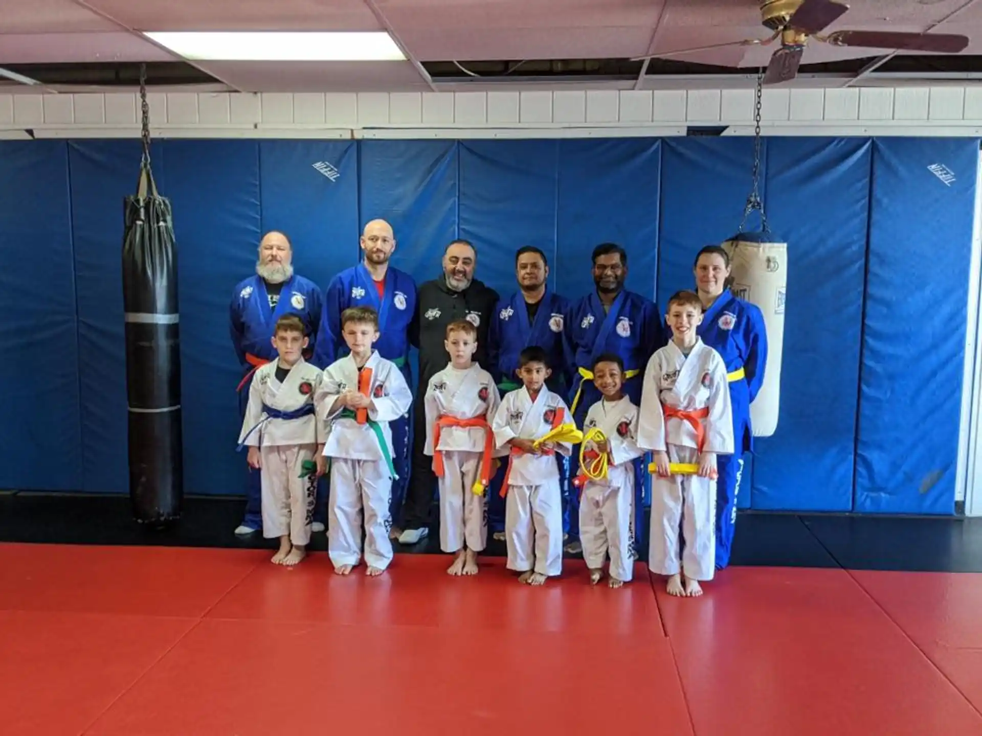 a group of people in karate uniforms