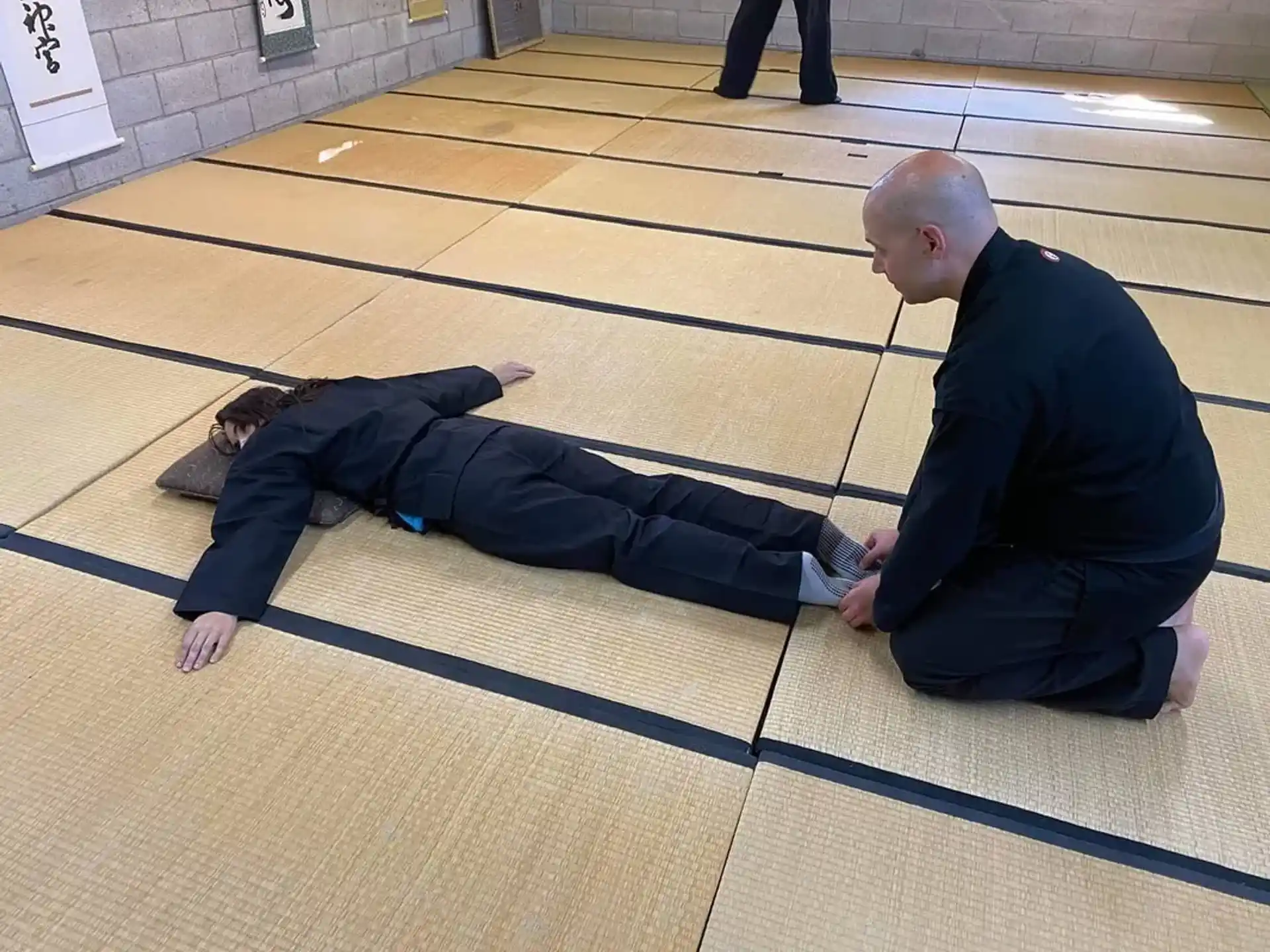 a man and a woman lying on the ground