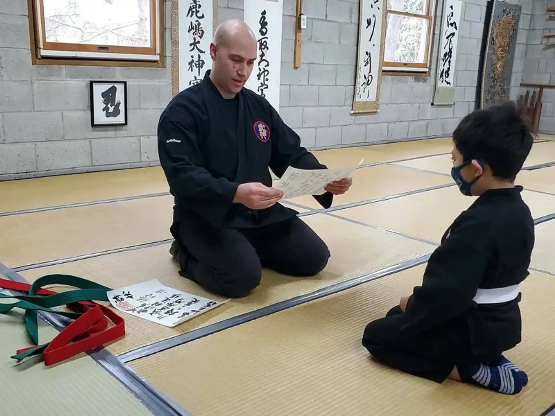 a person and a boy sitting on the floor