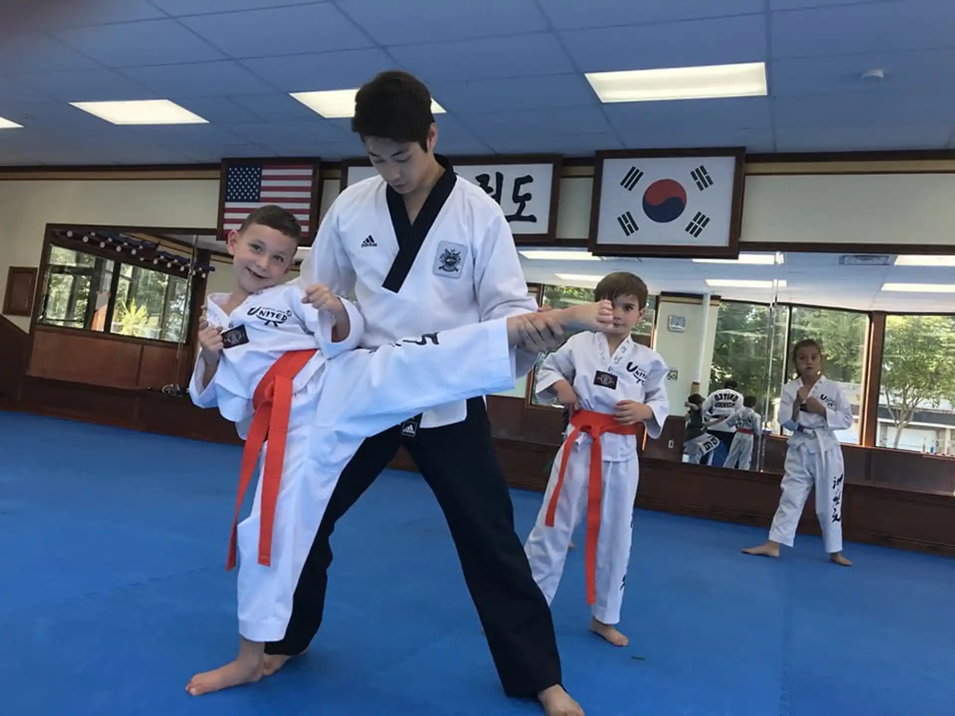a group of boys in karate uniforms