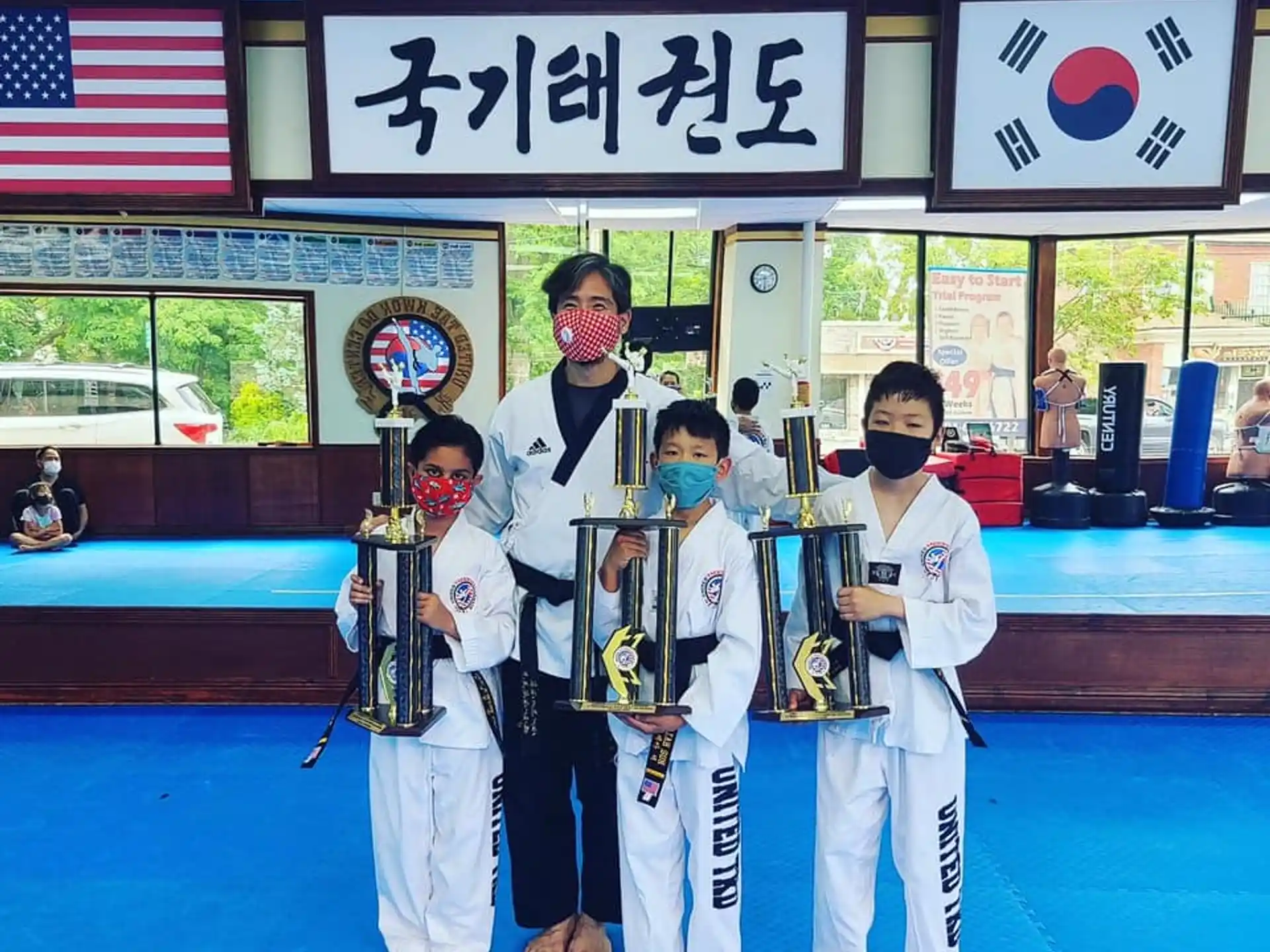 a group of people in karate uniforms