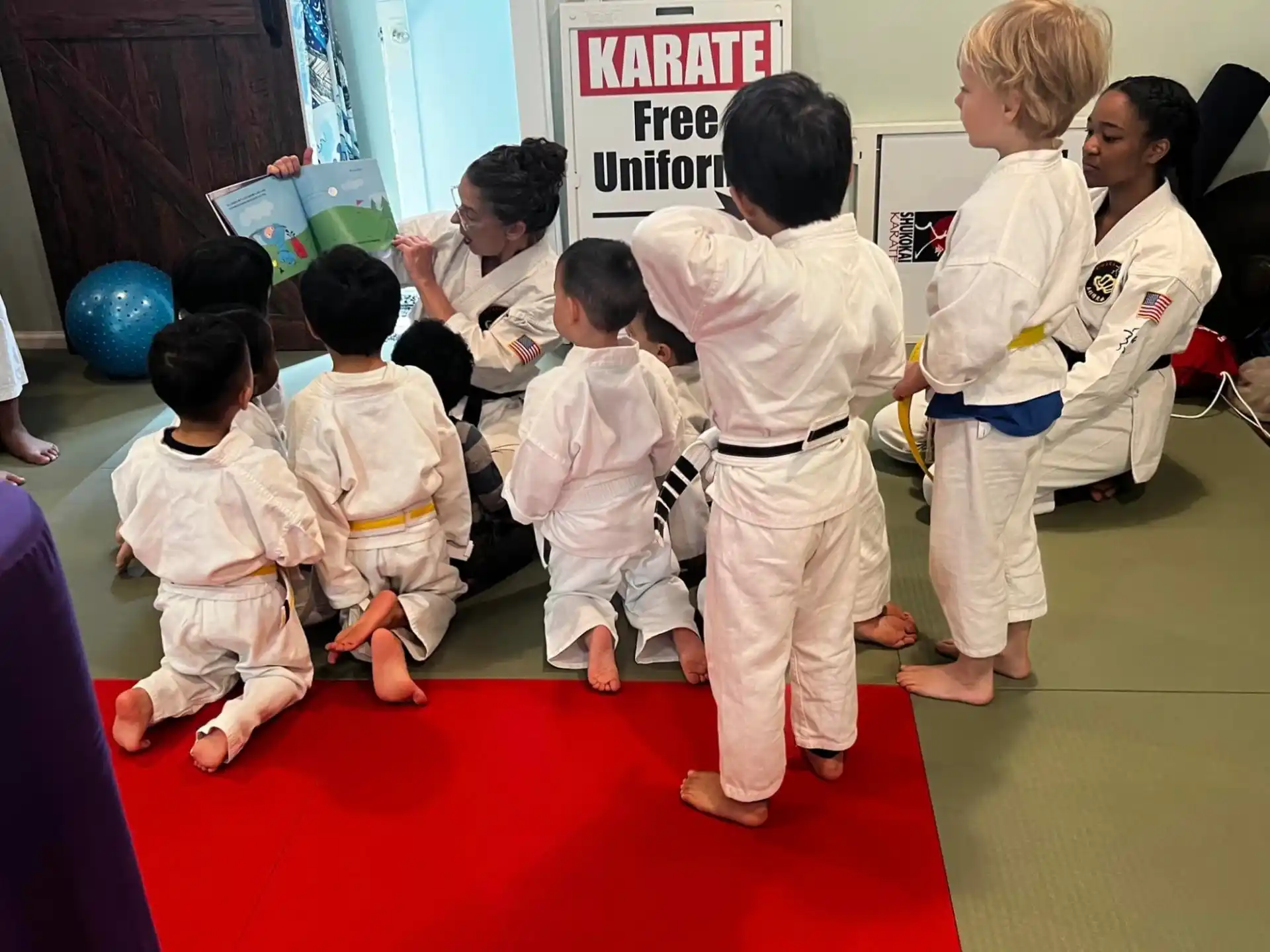 a group of kids in karate uniforms