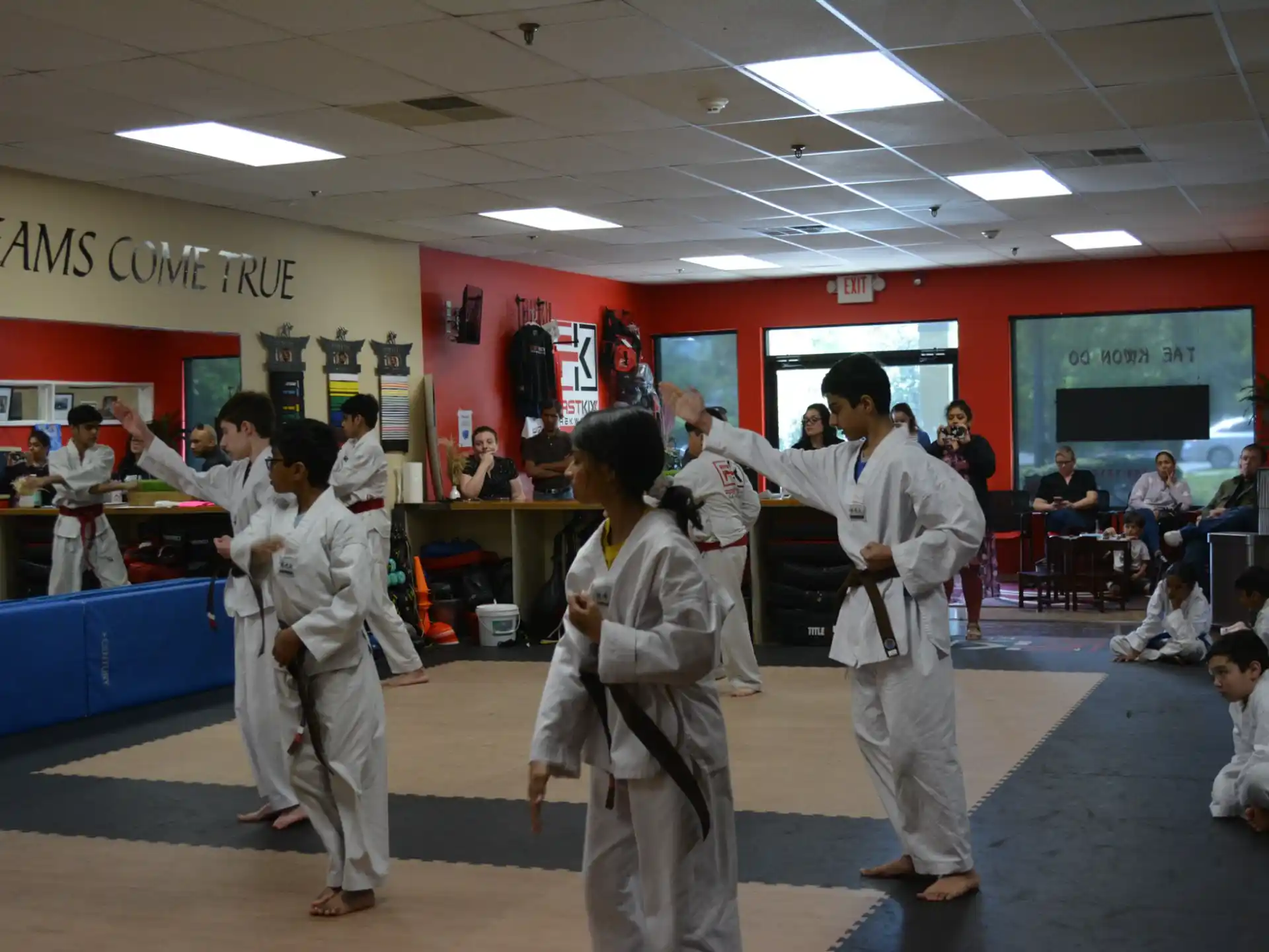 a group of people in karate uniforms