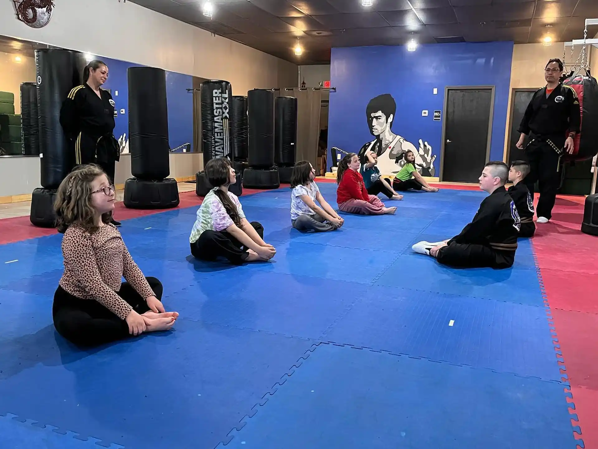 a group of people sitting on the floor