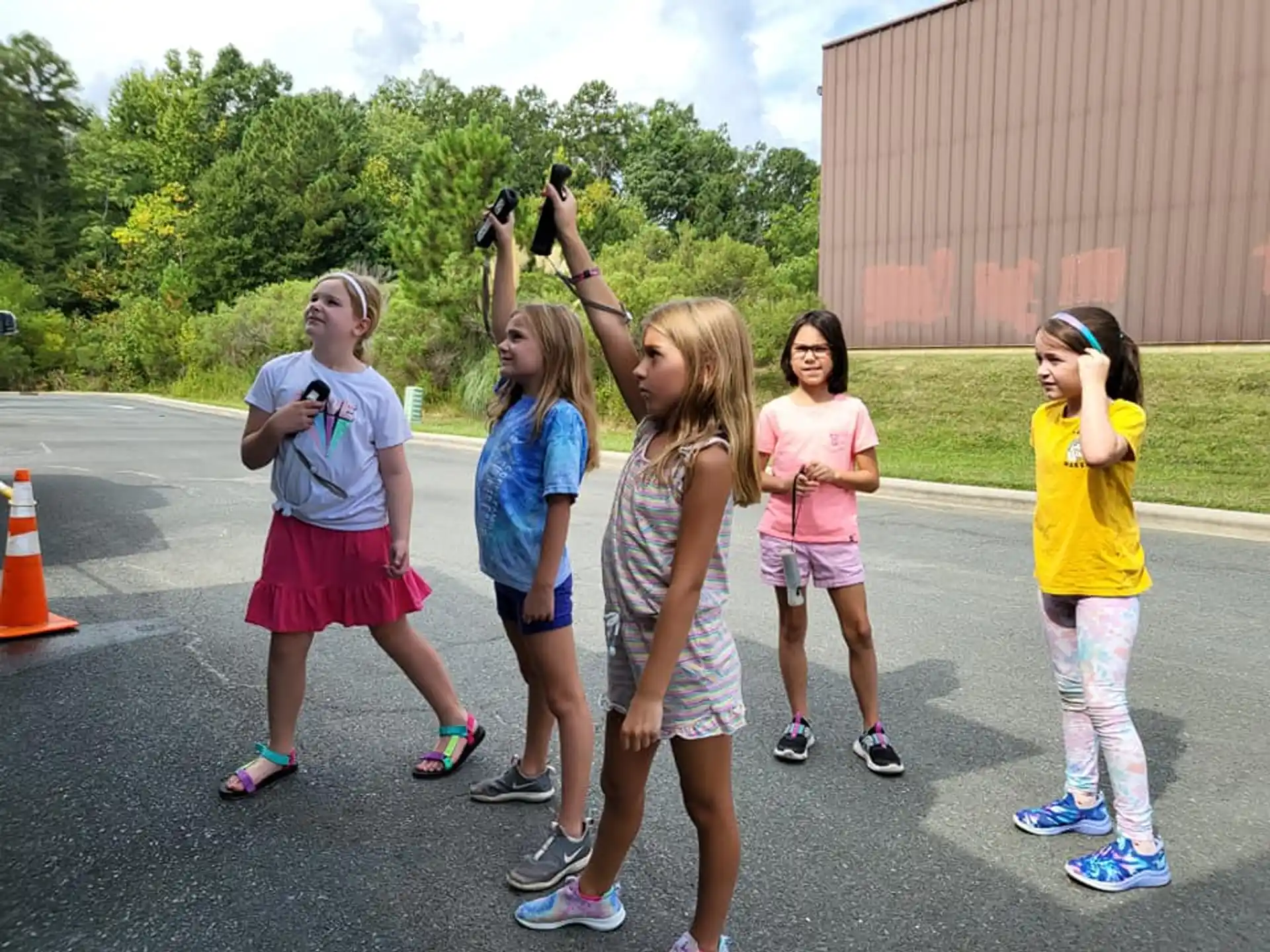 a group of girls taking pictures