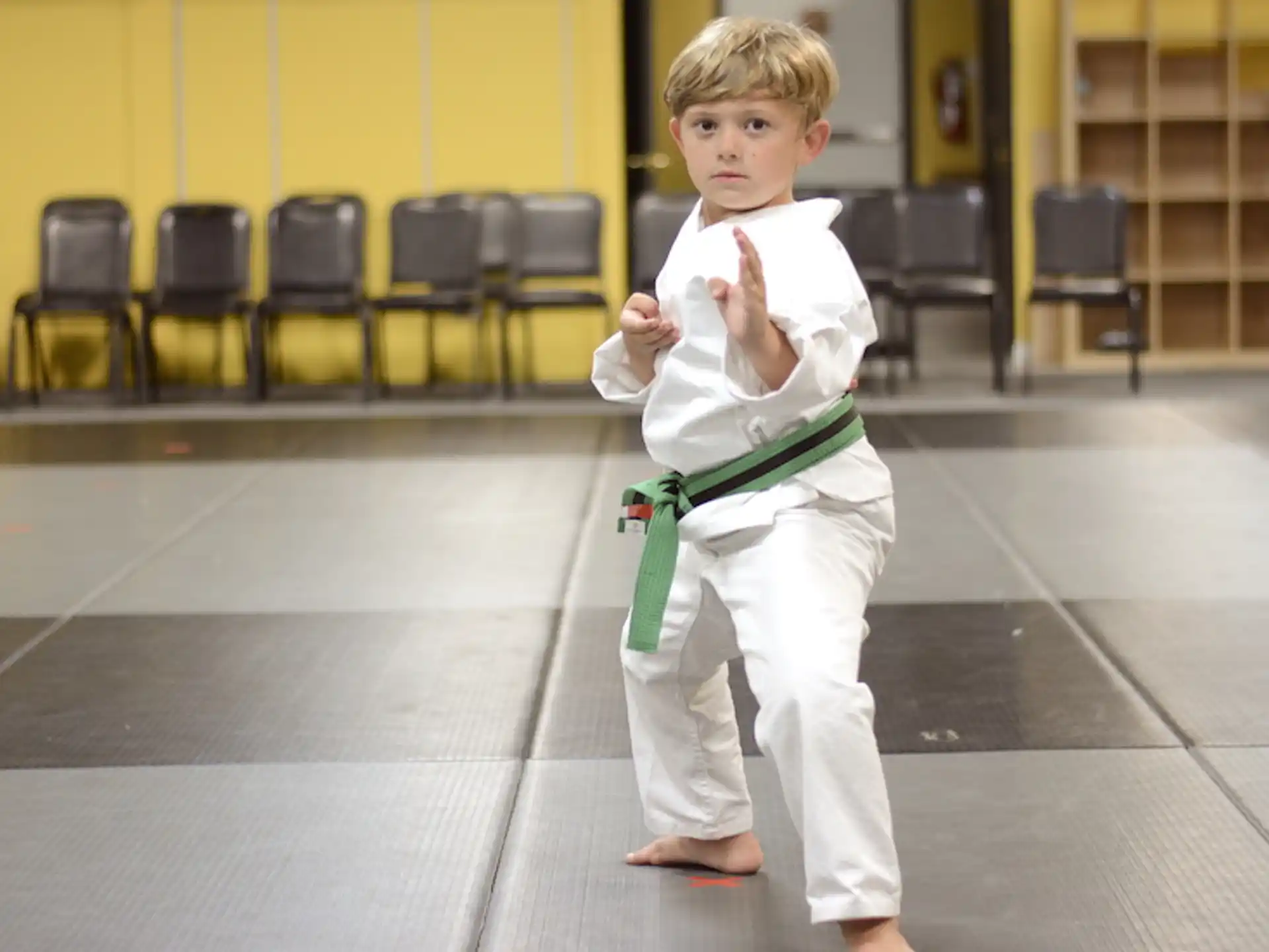 a boy in a karate uniform