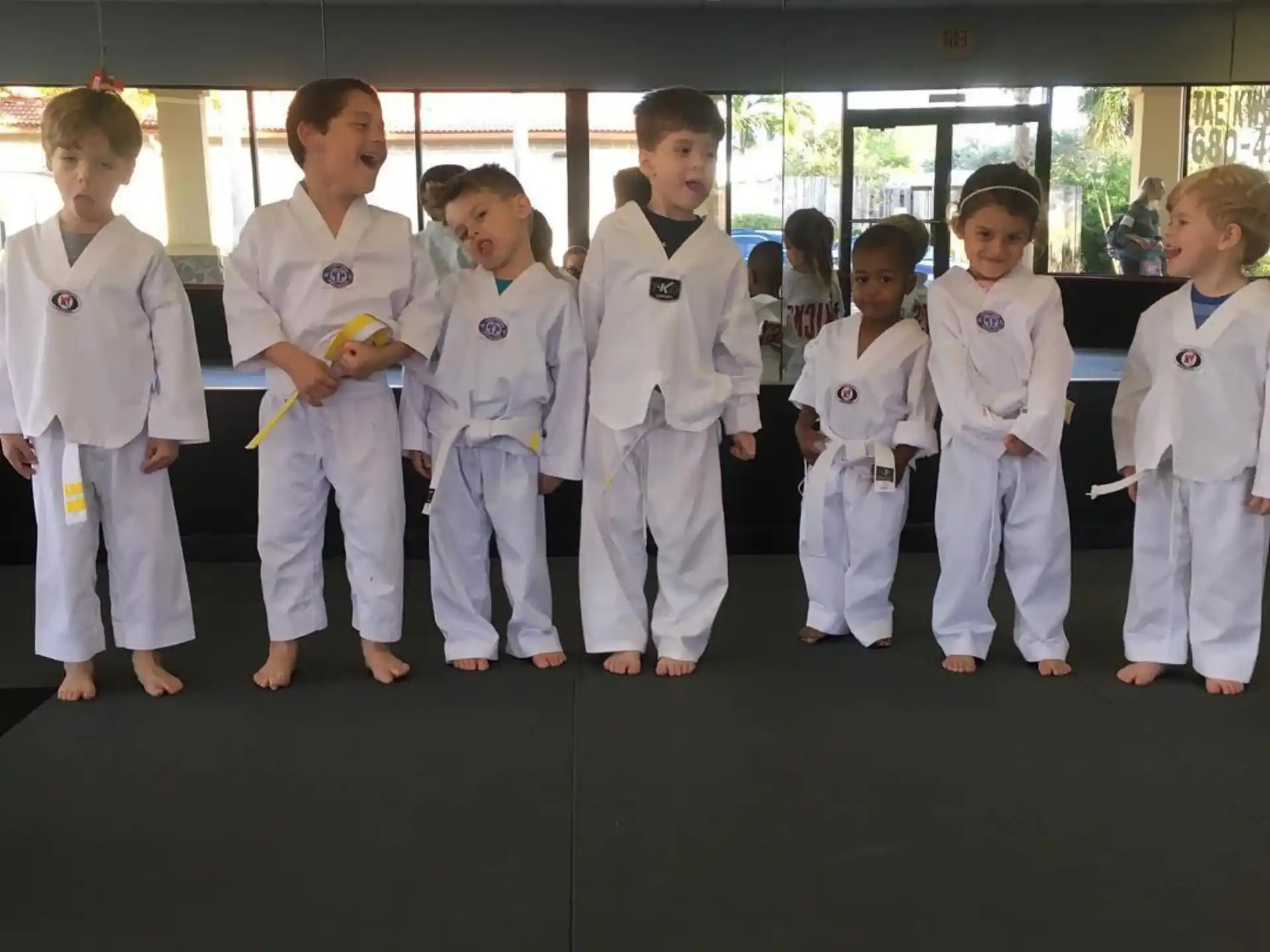 a group of people in karate uniforms