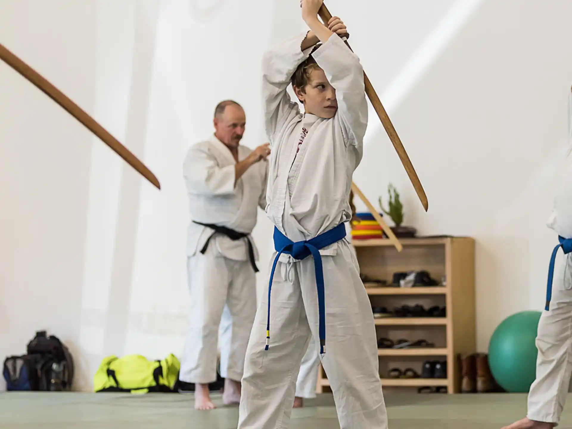 a group of people in karate uniforms