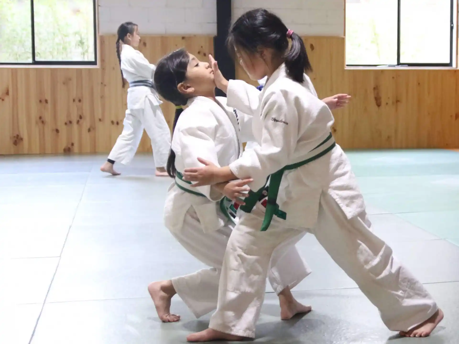 a group of people in karate uniforms