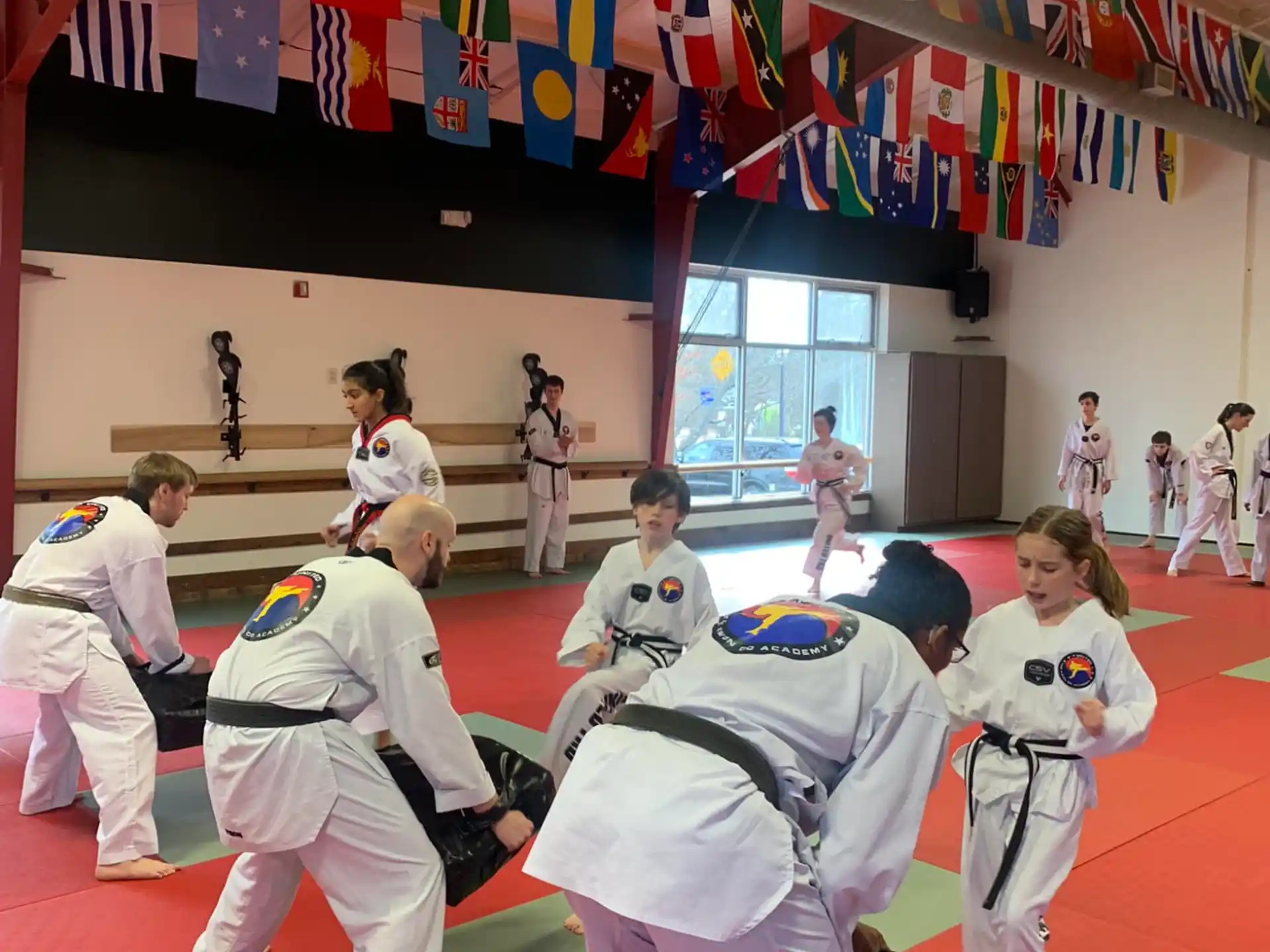 a group of people in karate uniforms