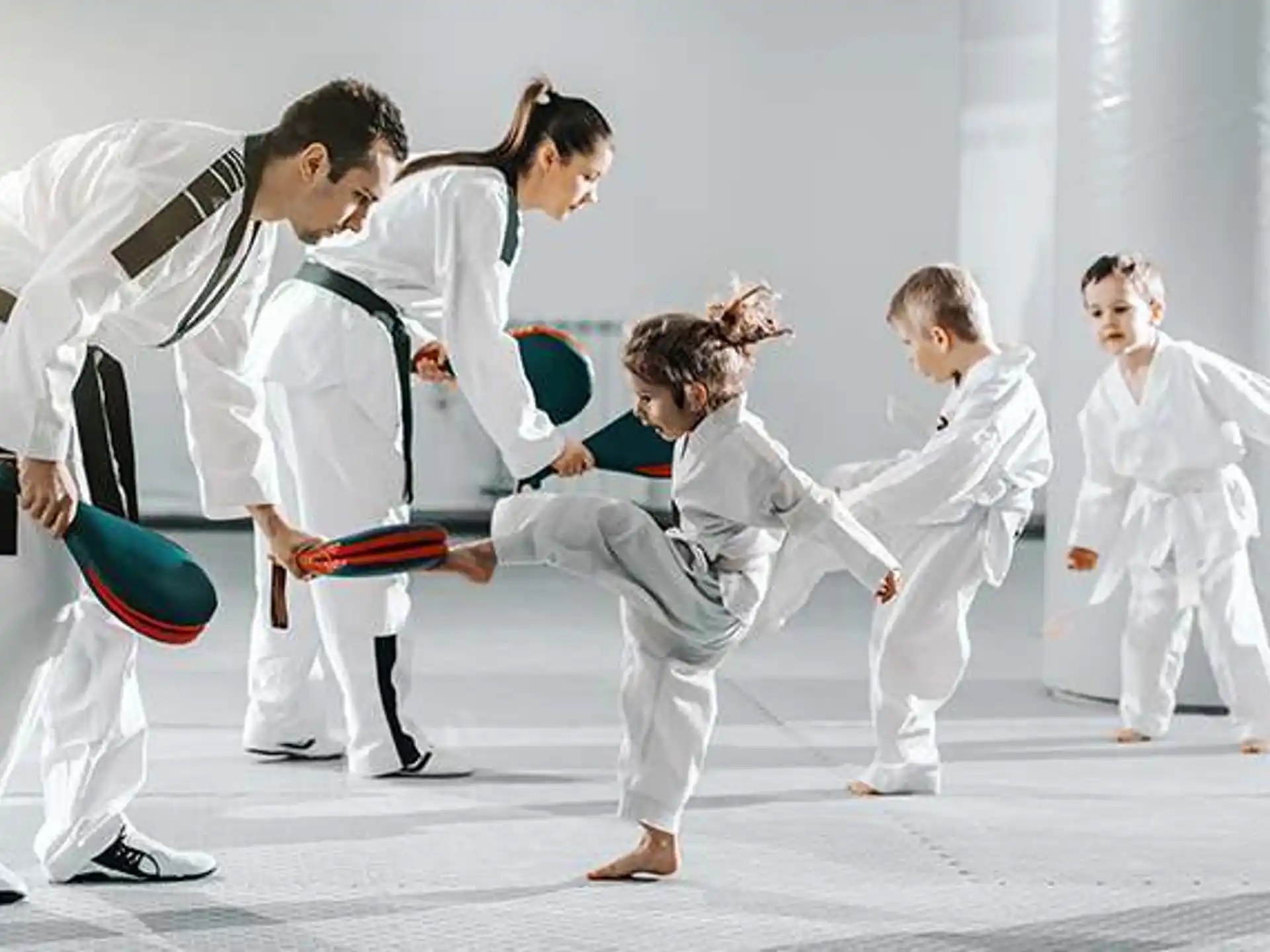 a group of people in karate uniforms