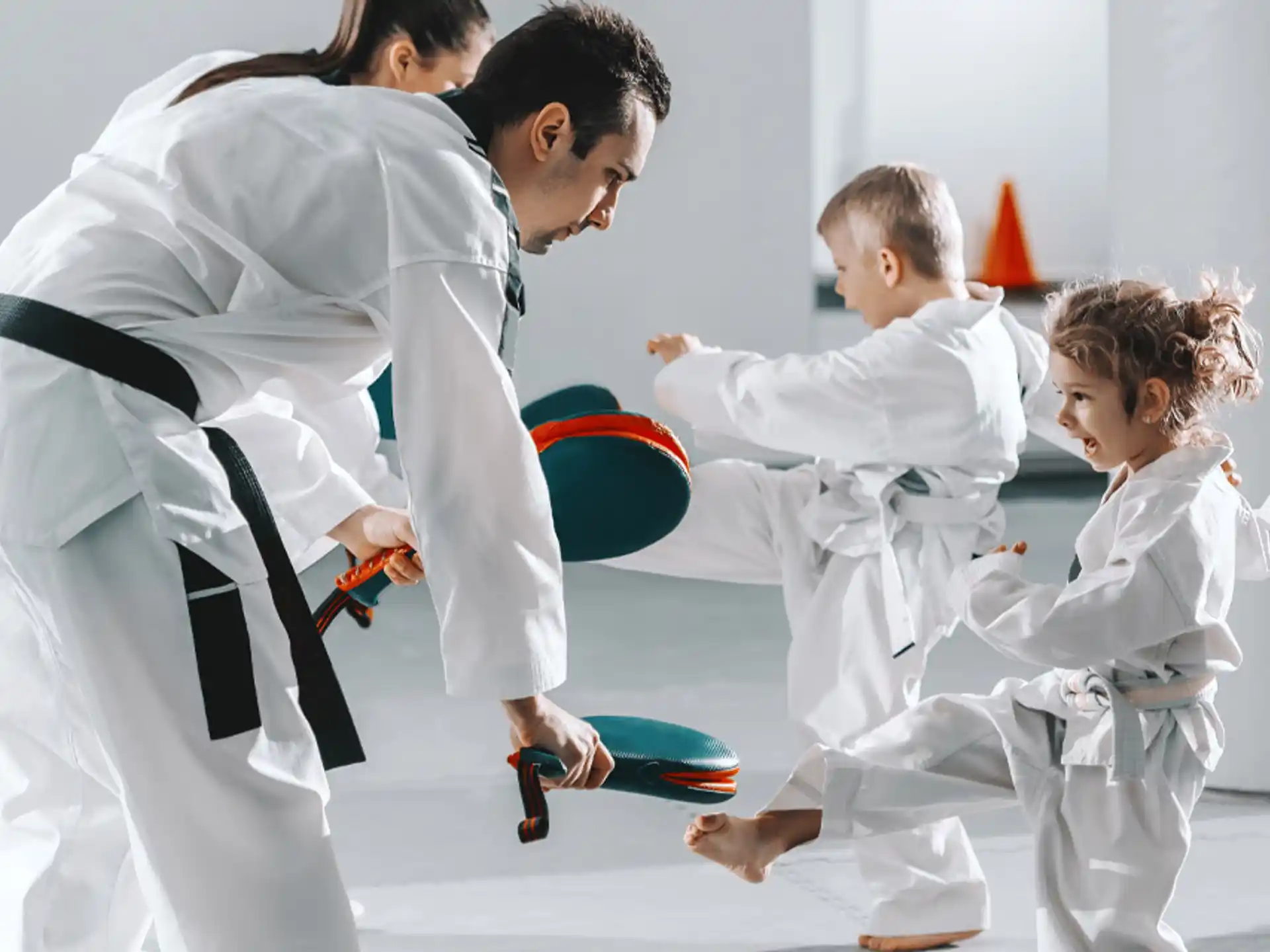 a group of people in karate uniforms