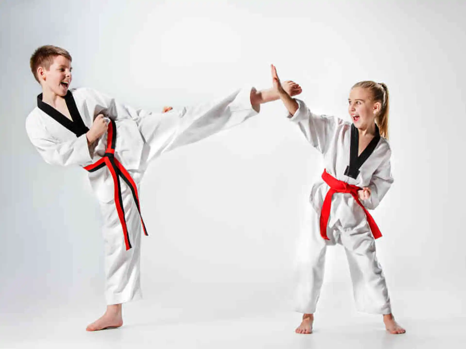a man and a woman in karate uniforms