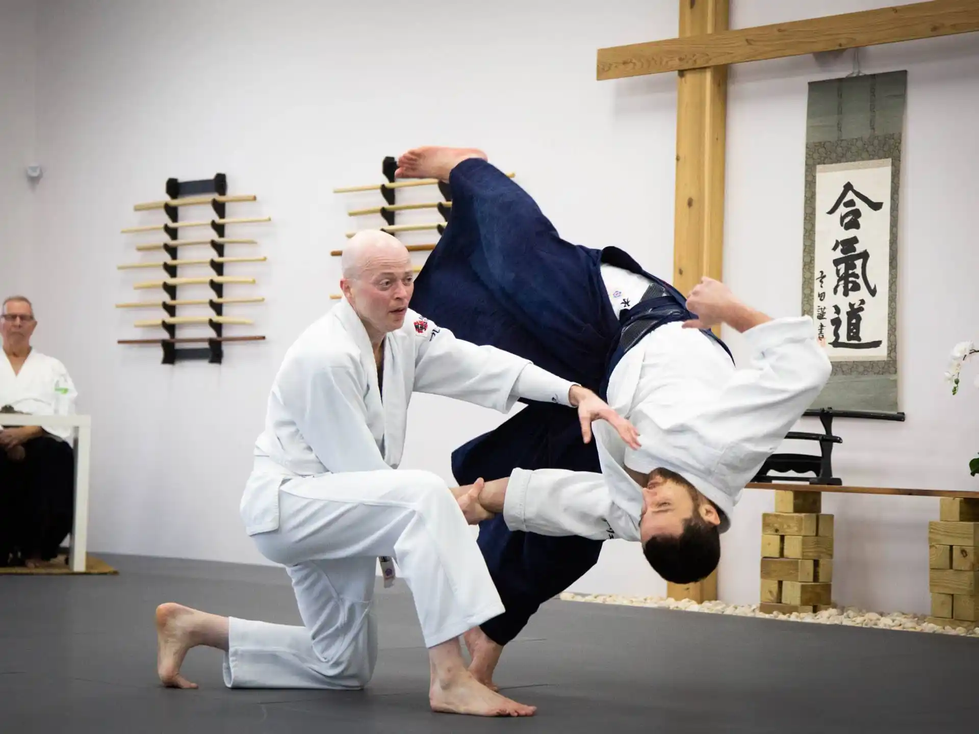 a man kicking another man in the face