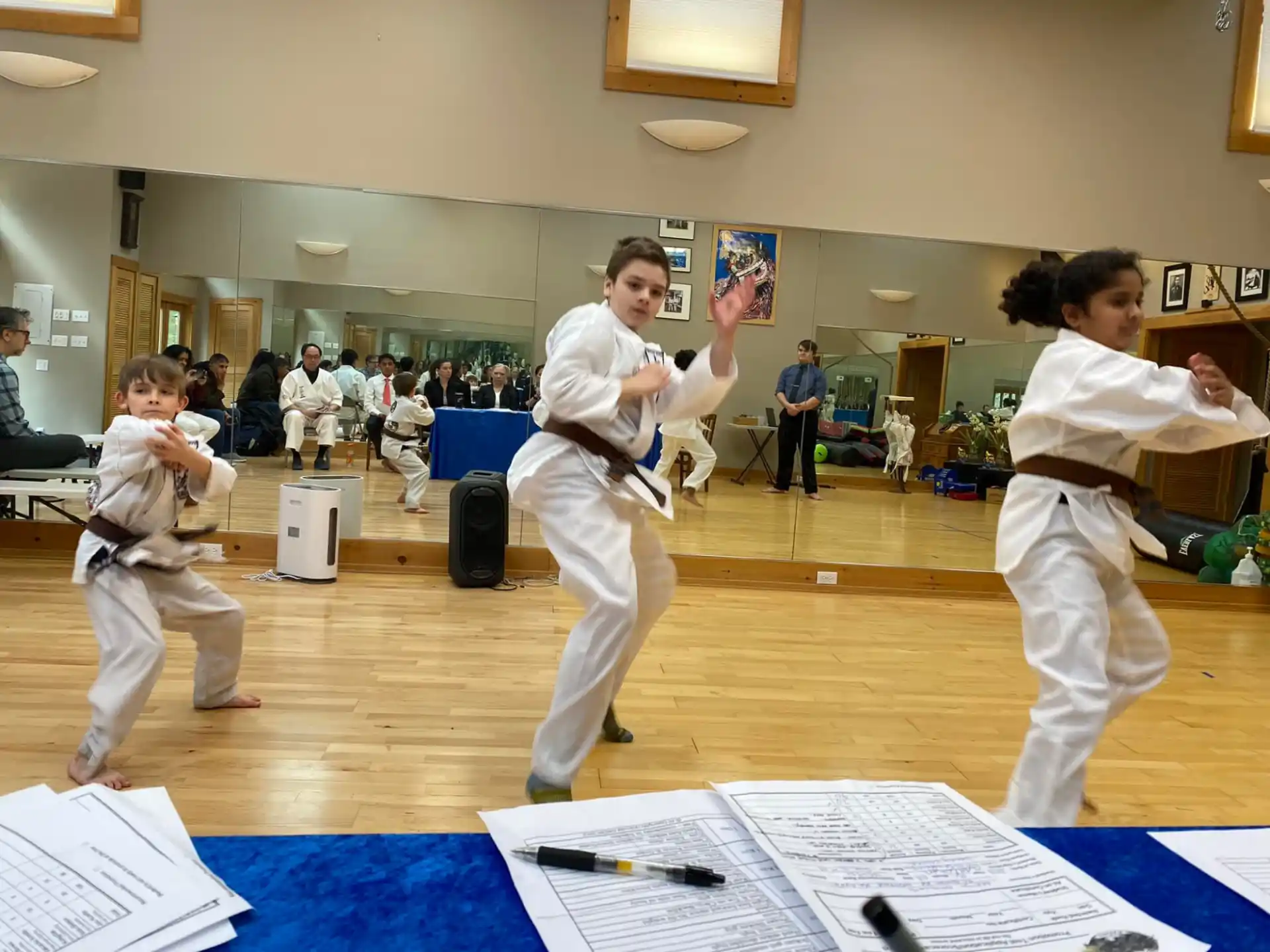 a group of people in karate uniforms
