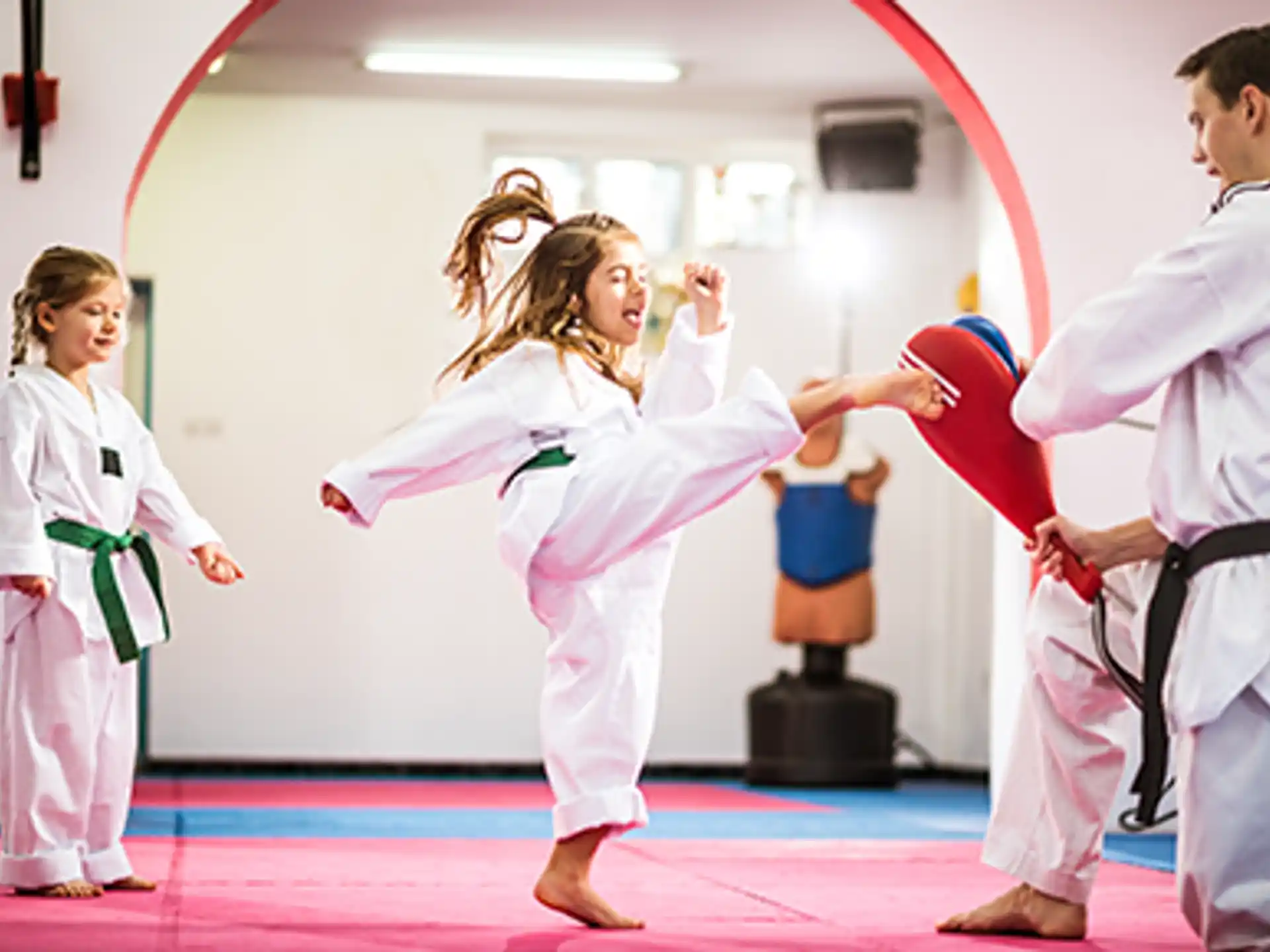 a group of people in karate uniforms