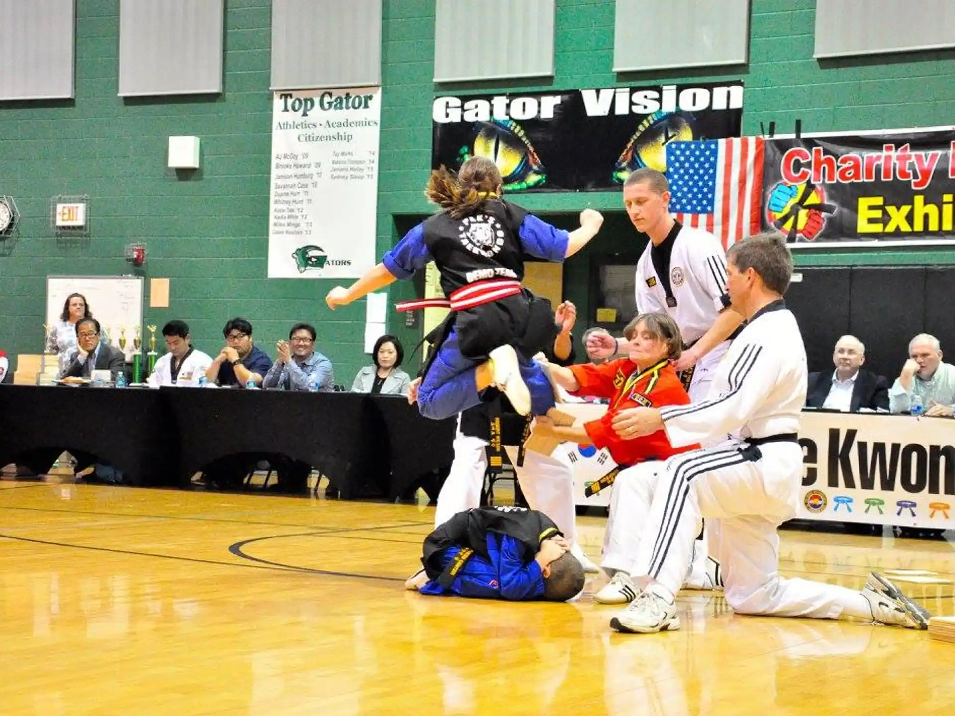 a man and a woman in karate uniforms on a court
