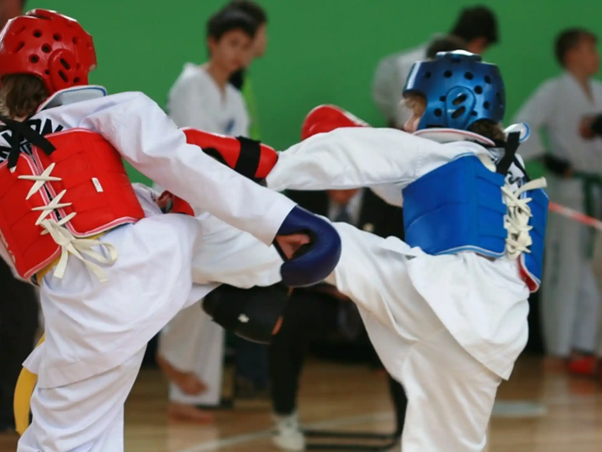 a group of people in a fighting match