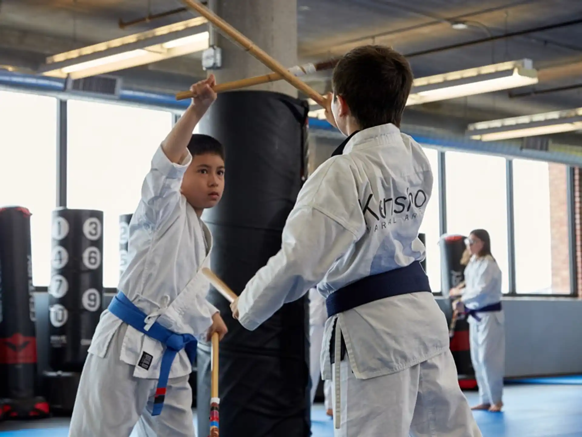 a group of people in karate uniforms