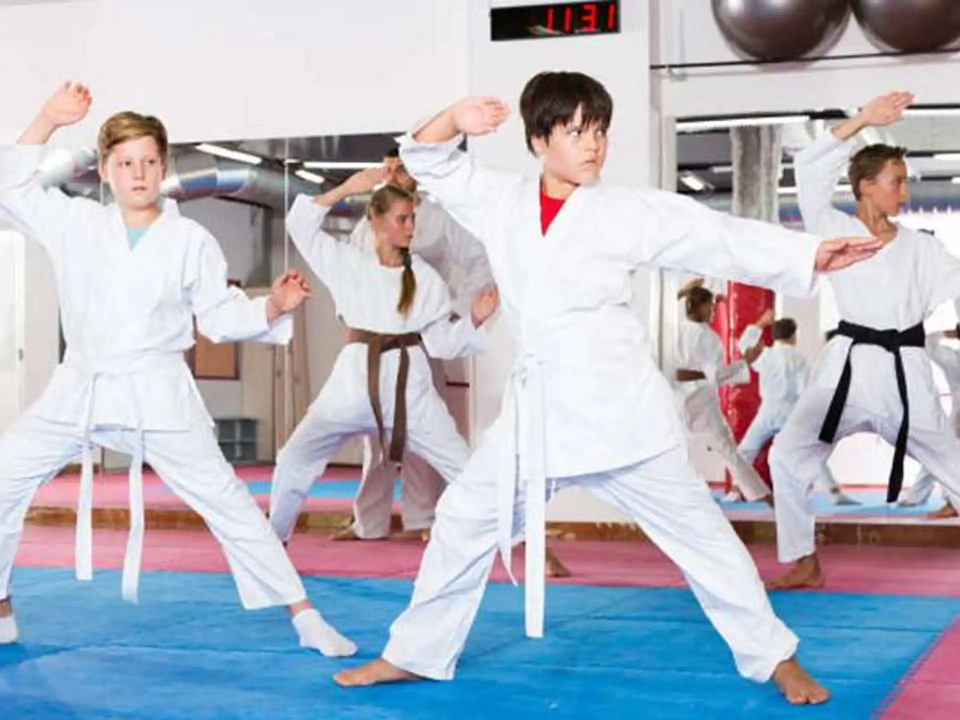 a group of people in karate uniforms