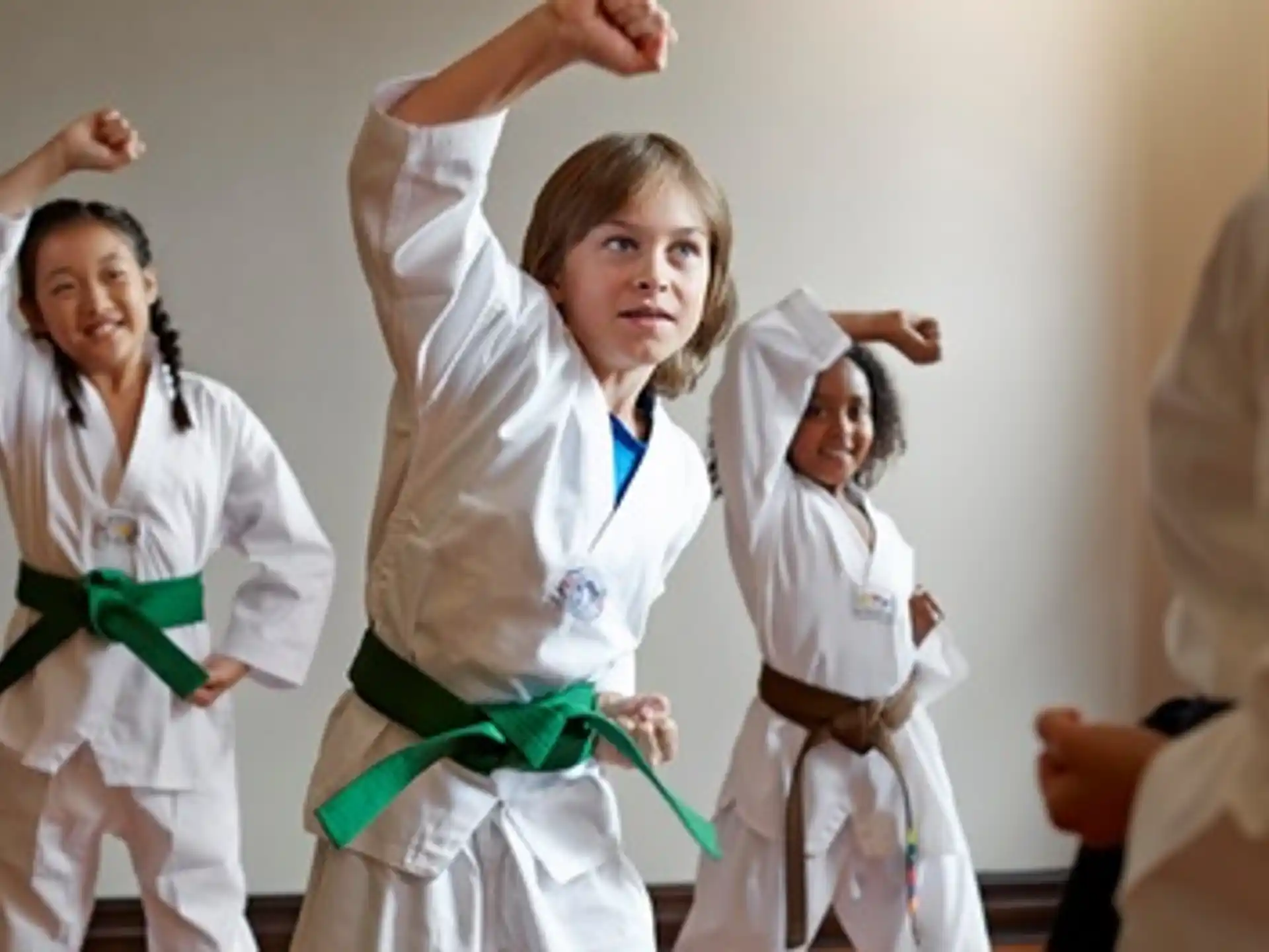 a group of people in white karate uniforms