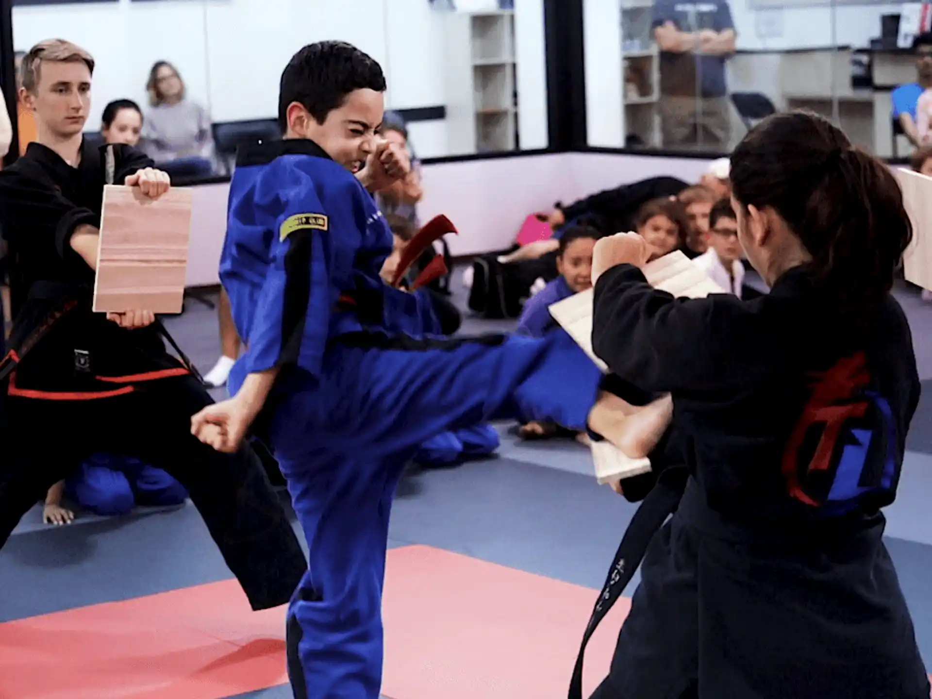 a group of people in karate uniforms