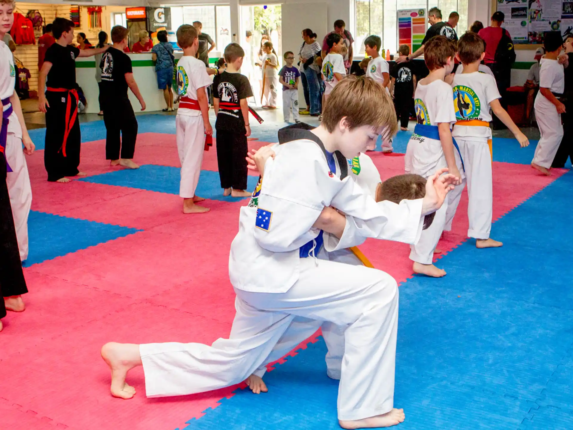 a group of people in karate uniforms