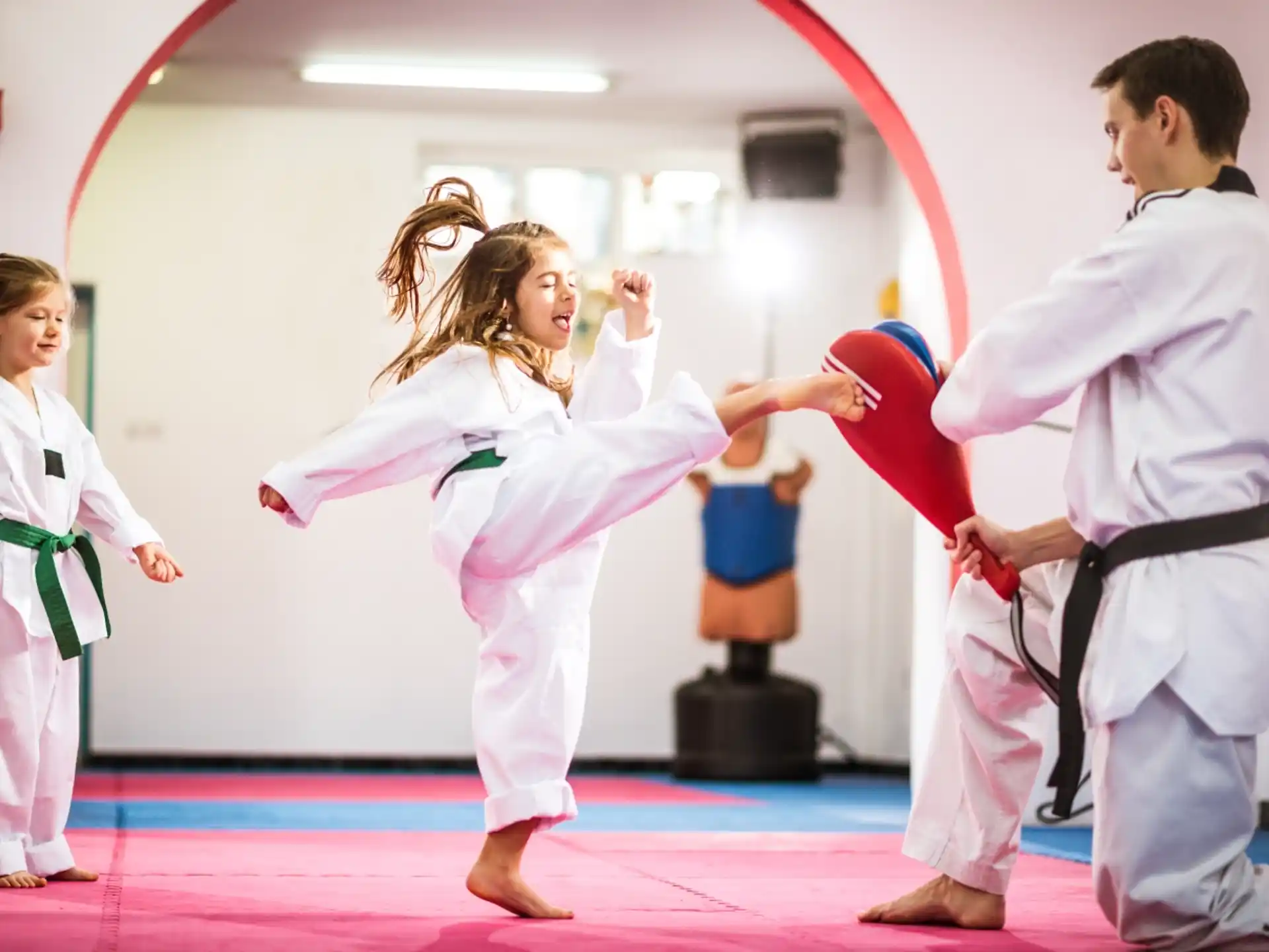 a group of people in karate uniforms