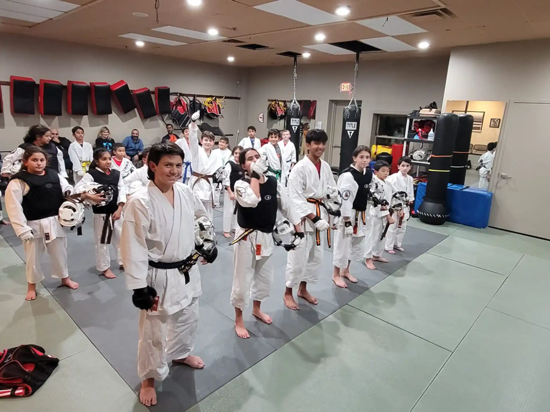 a group of people in karate uniforms