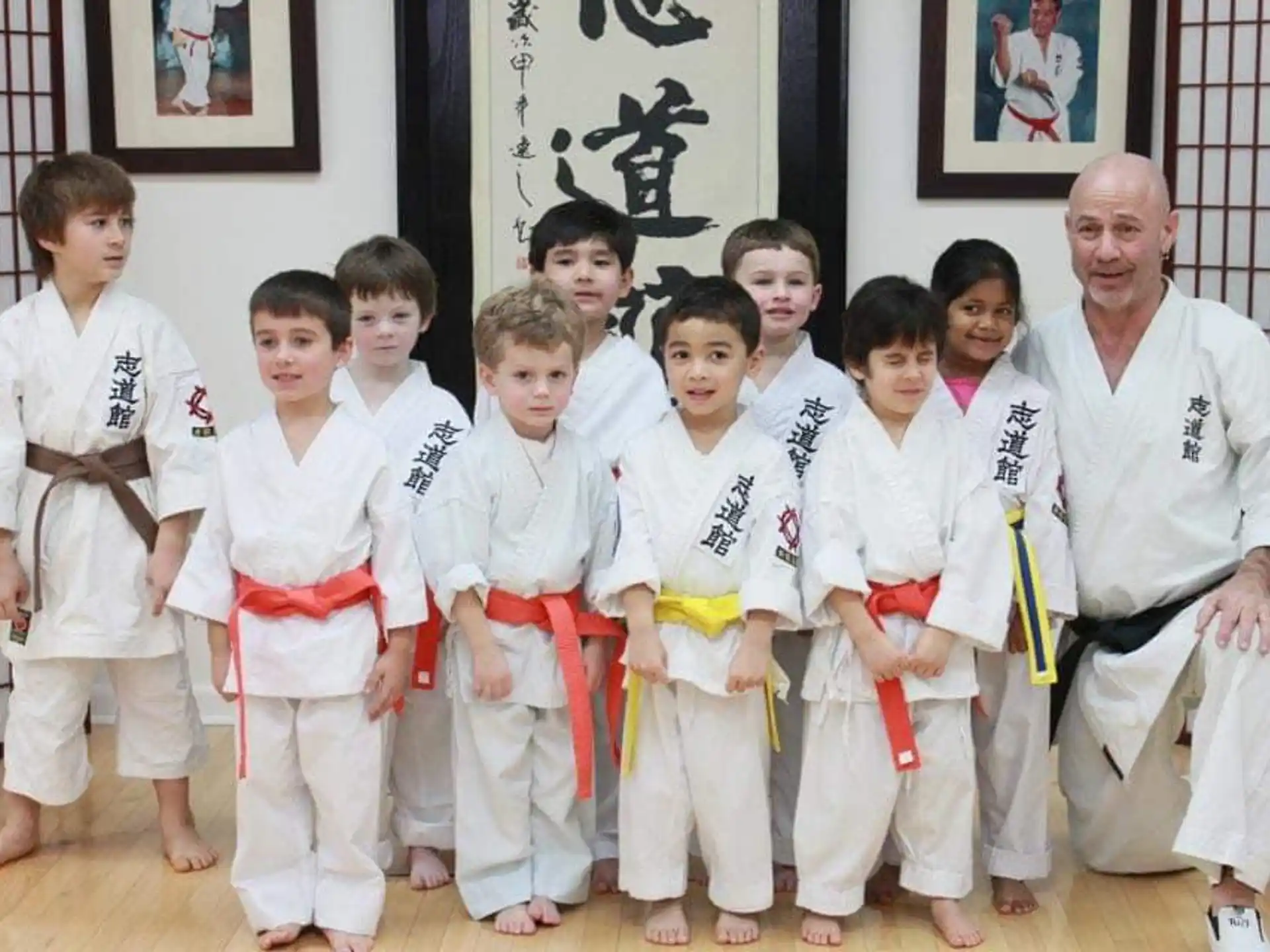 a group of people in karate uniforms