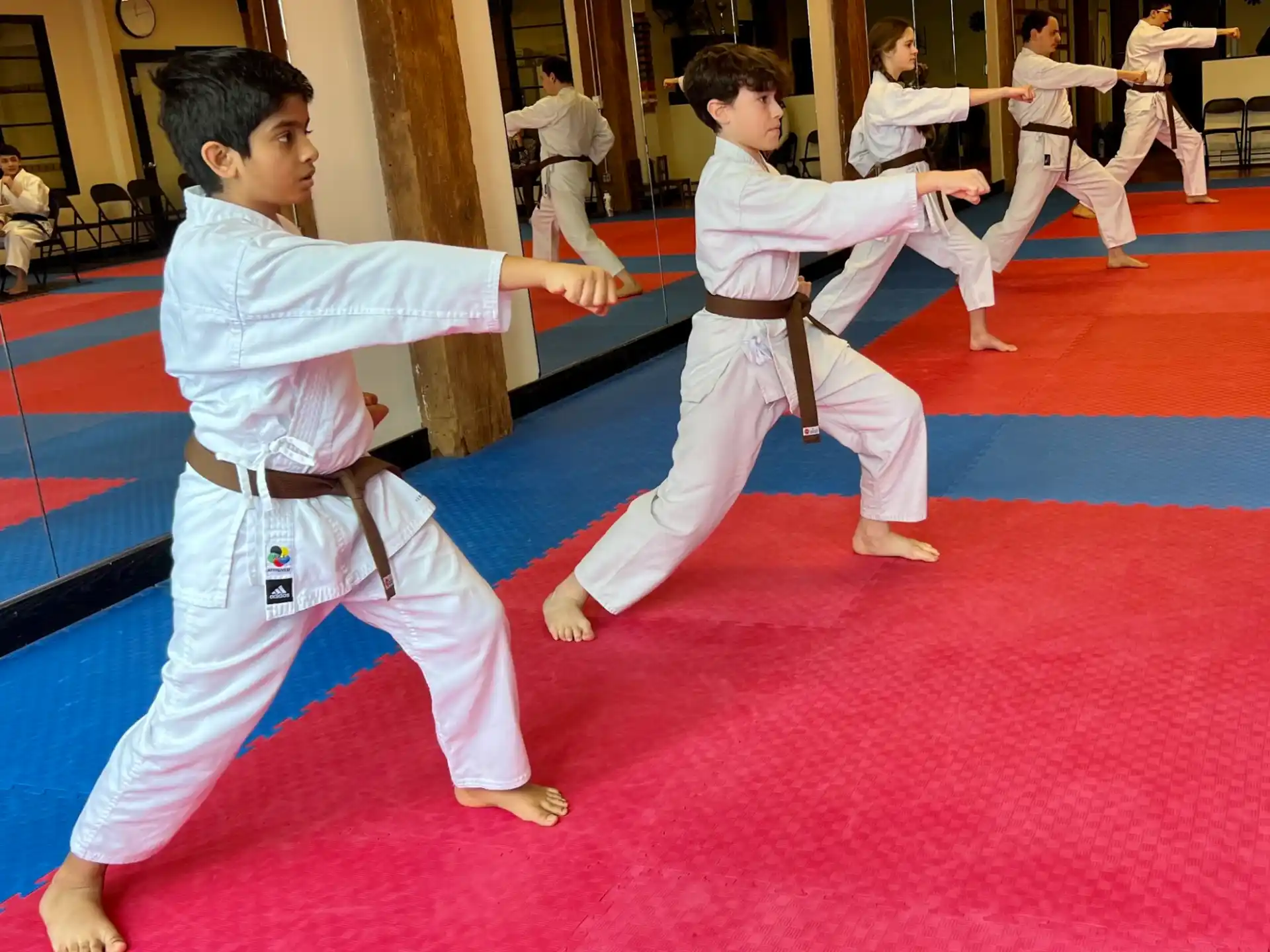 a group of boys practicing martial arts
