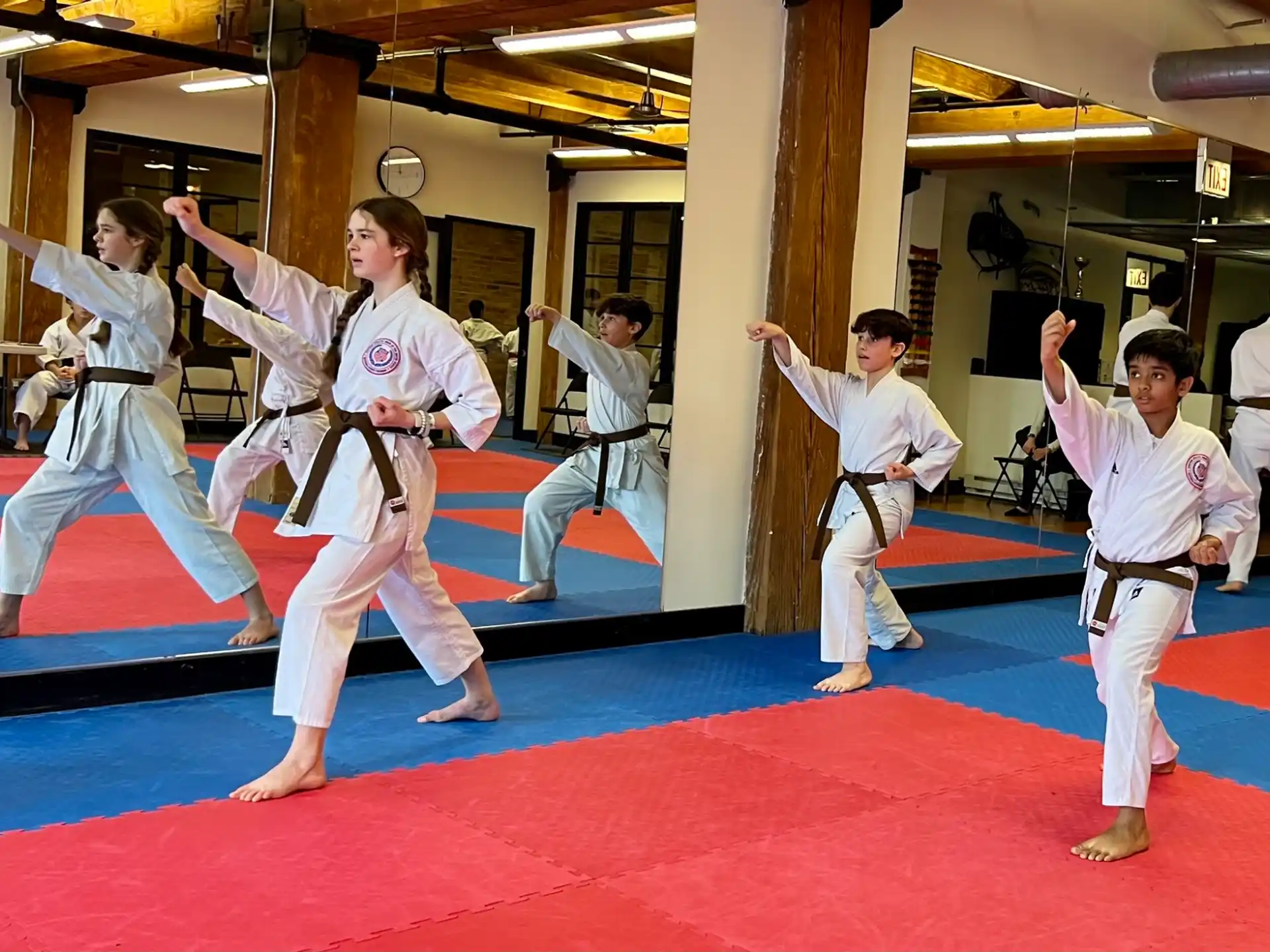 a group of people in karate uniforms