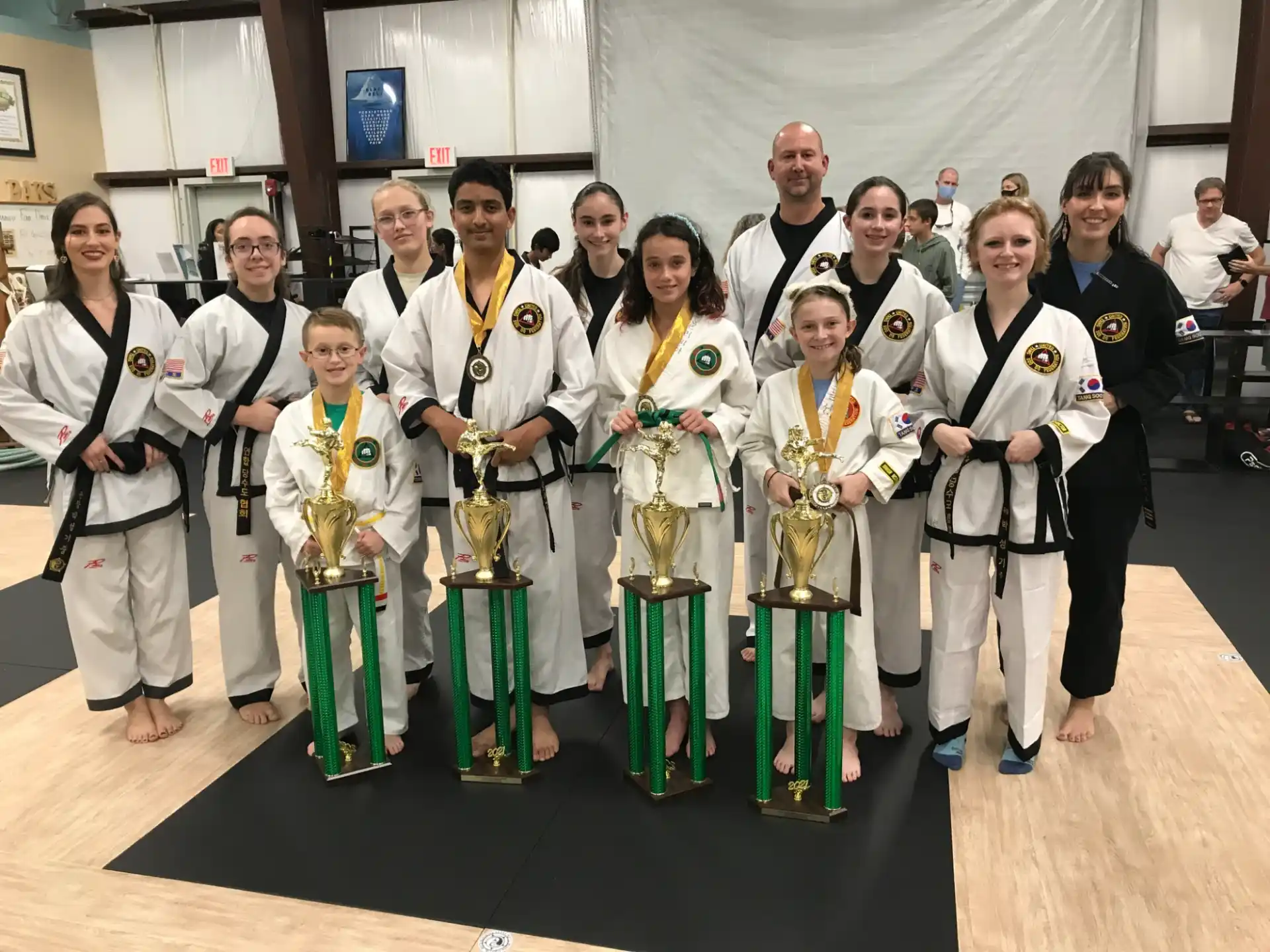 a group of people holding trophies